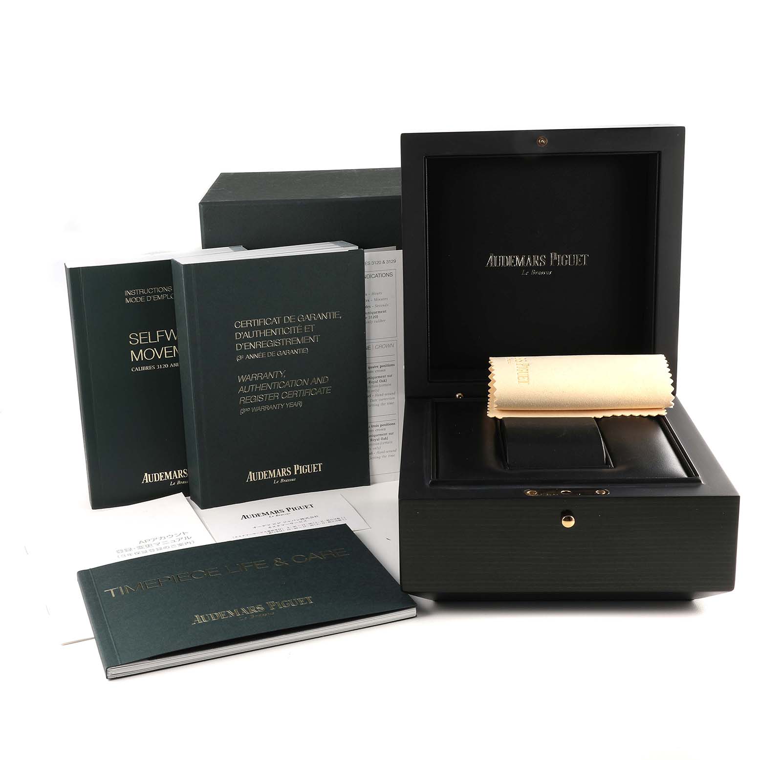 The image shows packaging contents of the Audemars Piguet Royal Oak 15400ST.OO.1220ST.01 Men's Stainless Steel Black Dial 15400ST.OO.1220ST.01 Men's Stainless Steel Black Dial, including a box, warranty certificates, instructions, and a cleaning cloth.