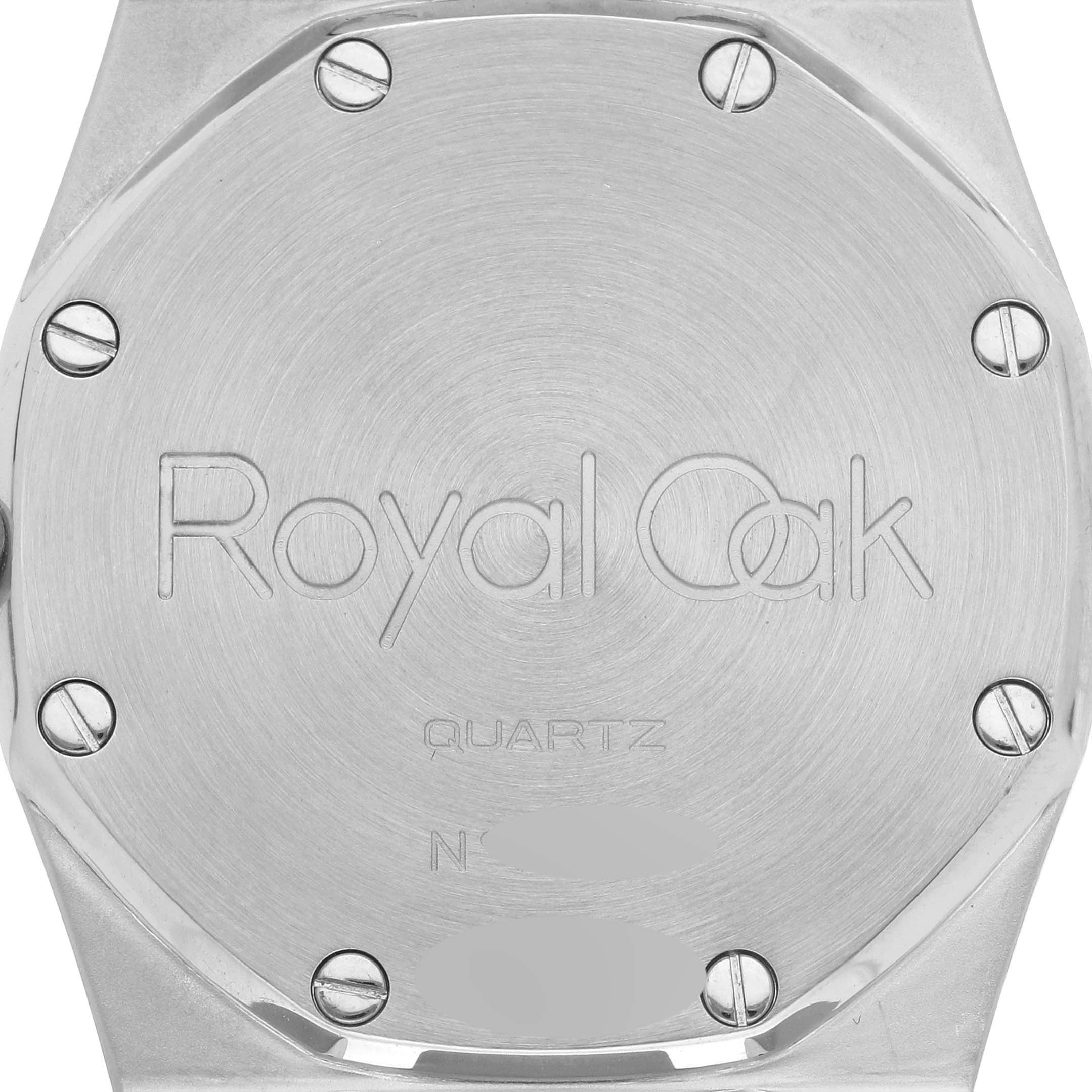 This image shows the back case of an Audemars Piguet Royal Oak 57175SA.OO.0789SA.01 Men's Steel and Gold (two tone) White Dial 57175SA.OO.0789SA.01 Men's Steel and Gold (two tone) White Dial watch with serrated screws and engravings.