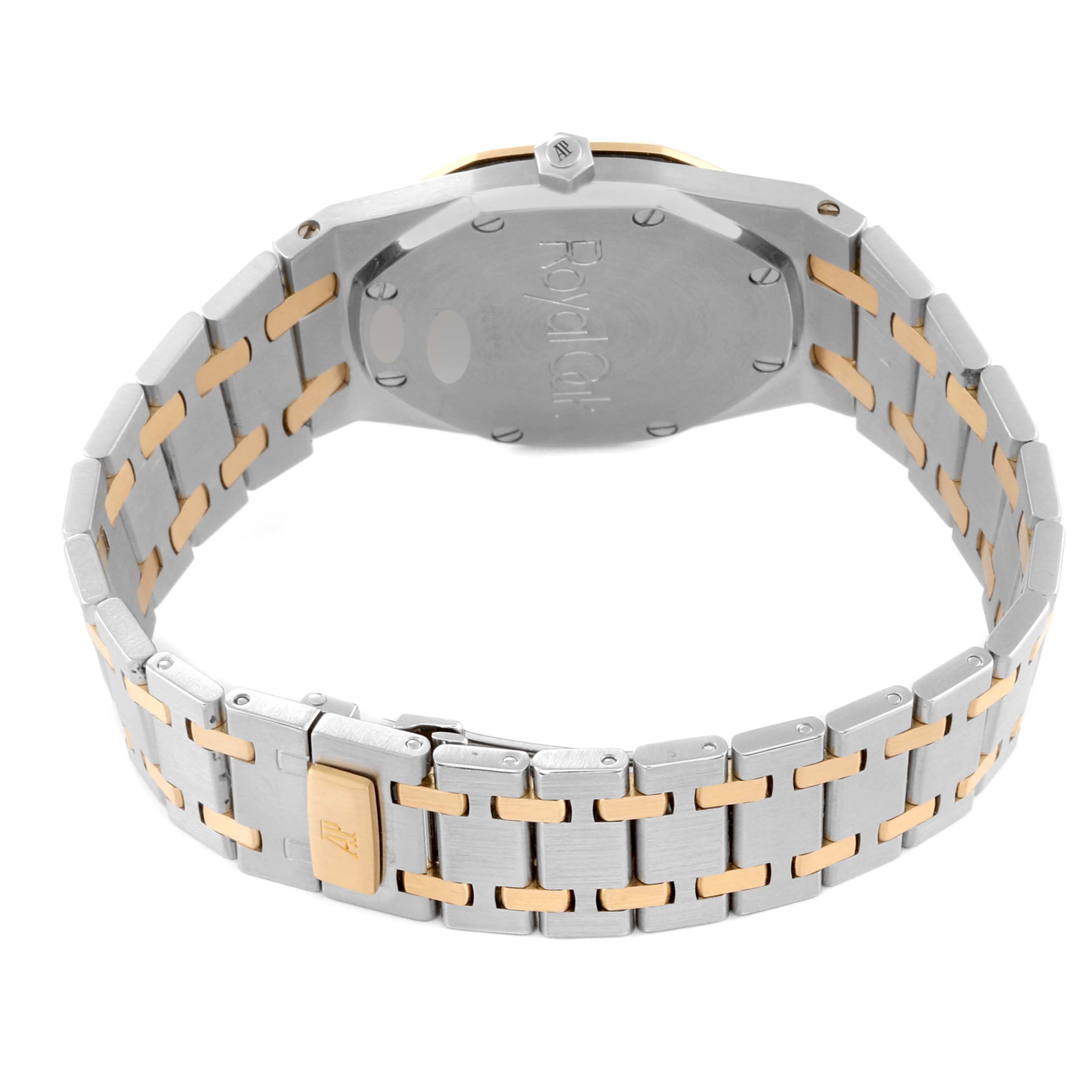 The image shows the Royal Oak model by Audemars Piguet from an angle highlighting the back case and metal bracelet. 