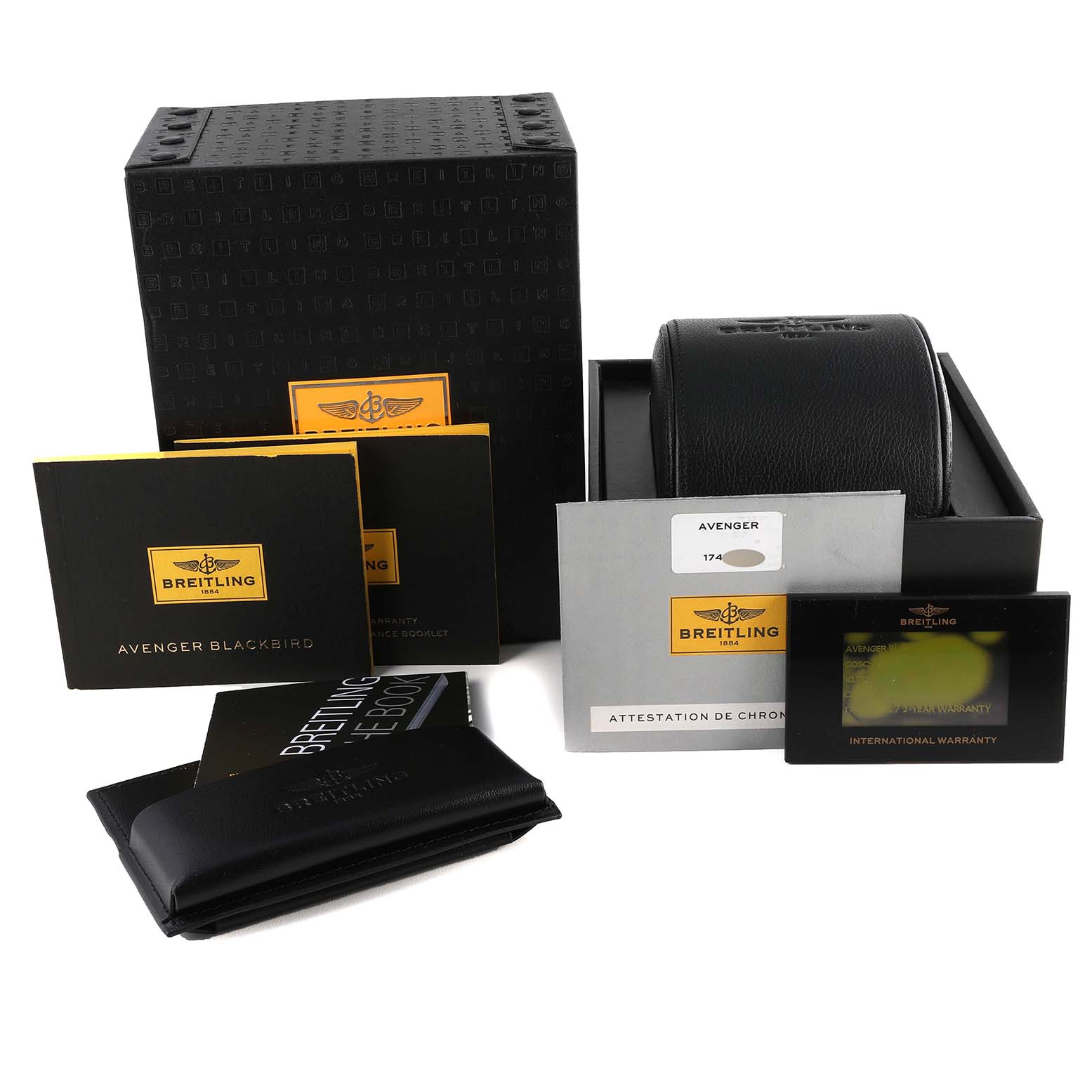 The image shows the packaging, warranty cards, manuals, and a leather case for a Breitling Avenger V173111 Men's Titanium Black Dial V173111 Men's Titanium Black Dial watch.