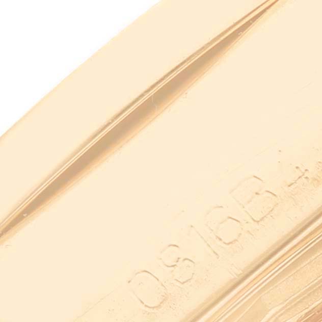 This image shows a close-up of the engraved part of the rose gold case of the Breitling H72348 Women's Rose Gold Mother of Pearl Dial H72348 Women's Rose Gold Mother of Pearl Dial Galactic 29 Mother of Pearl Dial Diamond Ladies Watch H72348.