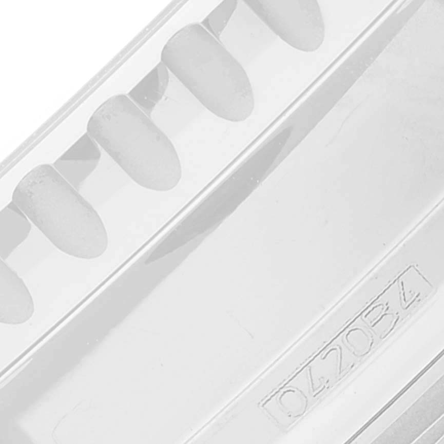 The image shows a close-up of a Navitimer model watch strap by Breitling, featuring its serial number and groove details.