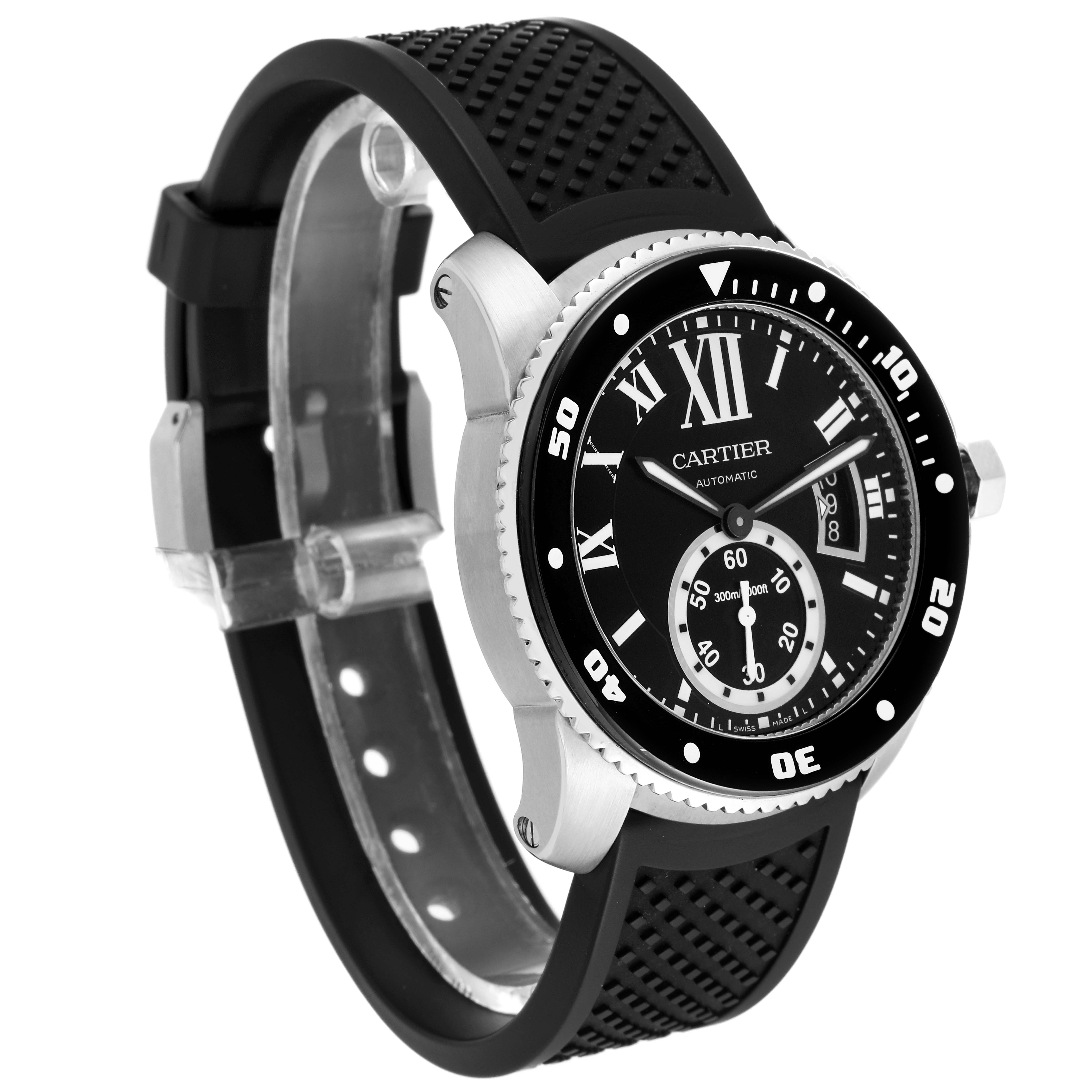 The image shows a Calibre de Cartier watch by Cartier at an angled view, displaying its face, bezel, and black rubber strap.
