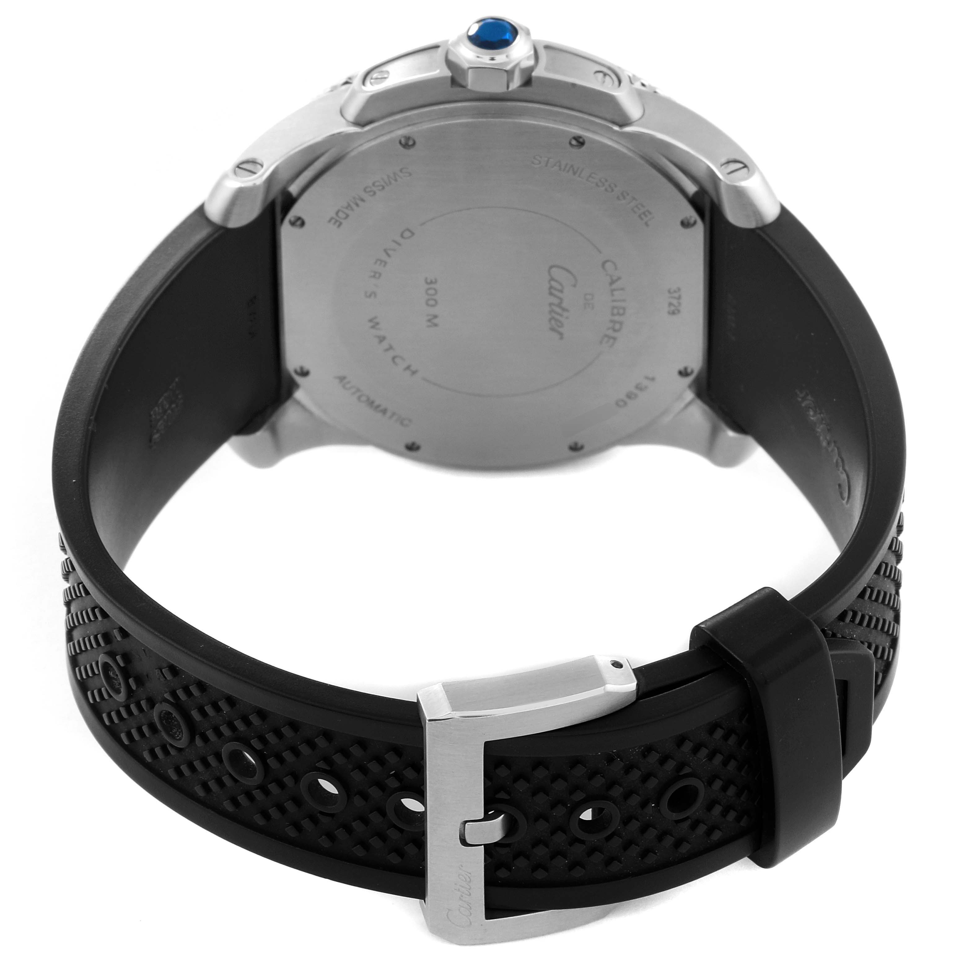 This image shows the back case and black strap of a Calibre de Cartier watch by Cartier.