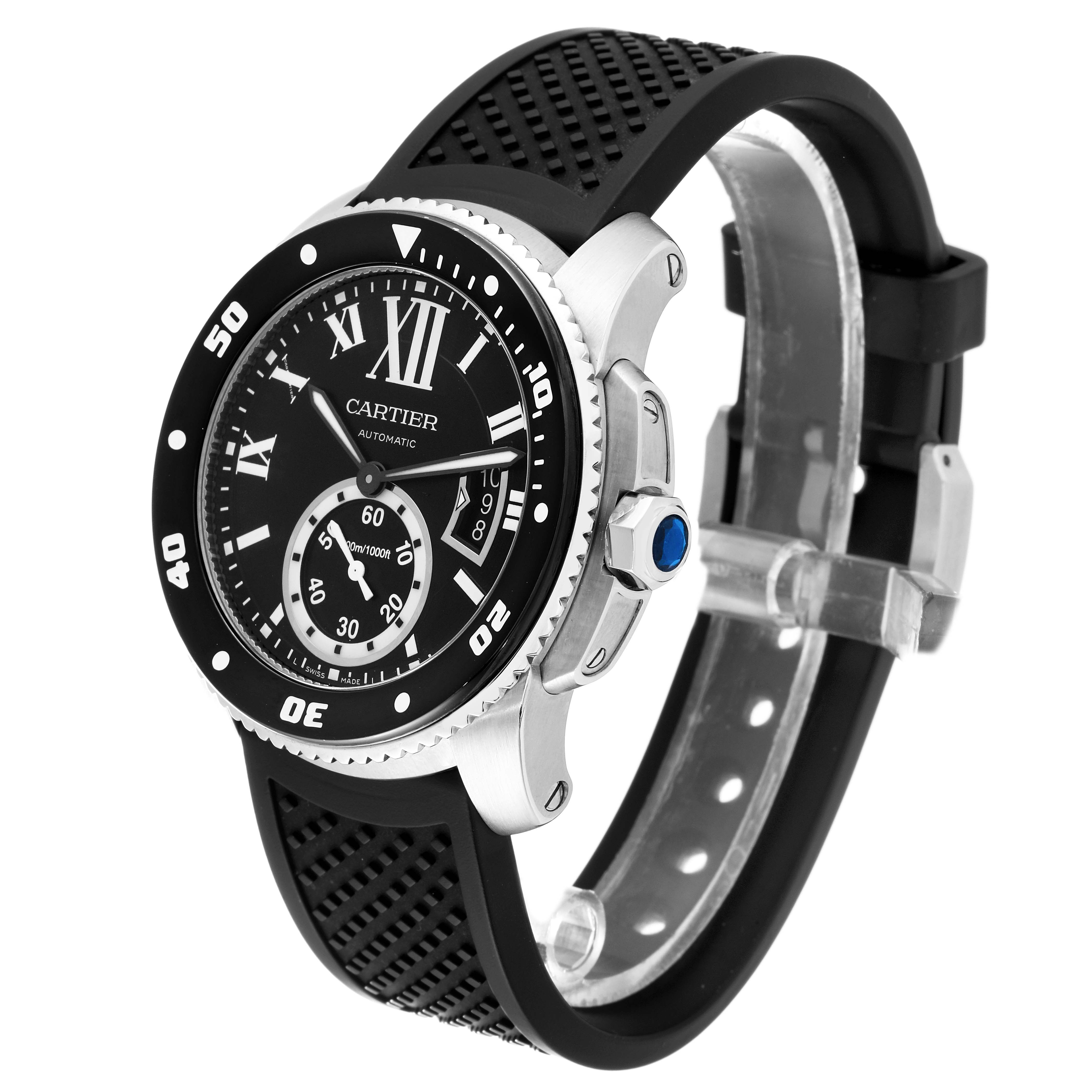 This Calibre de Cartier watch by Cartier is shown at an angle highlighting its black dial, bezel, crown, and rubber strap.