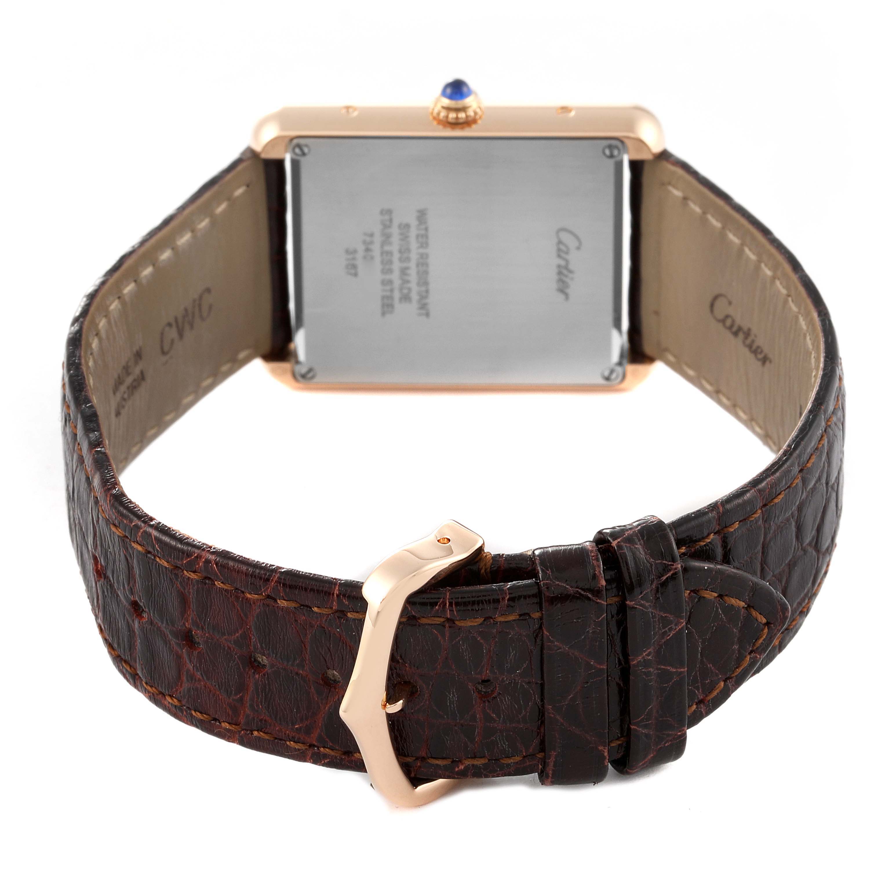 The image shows the back of a Cartier Tank Solo W5200025 Men
s Rose Gold Silver Dial W5200025 Men
s Rose Gold Silver Dial watch, featuring its case back and leather strap with a buckle.