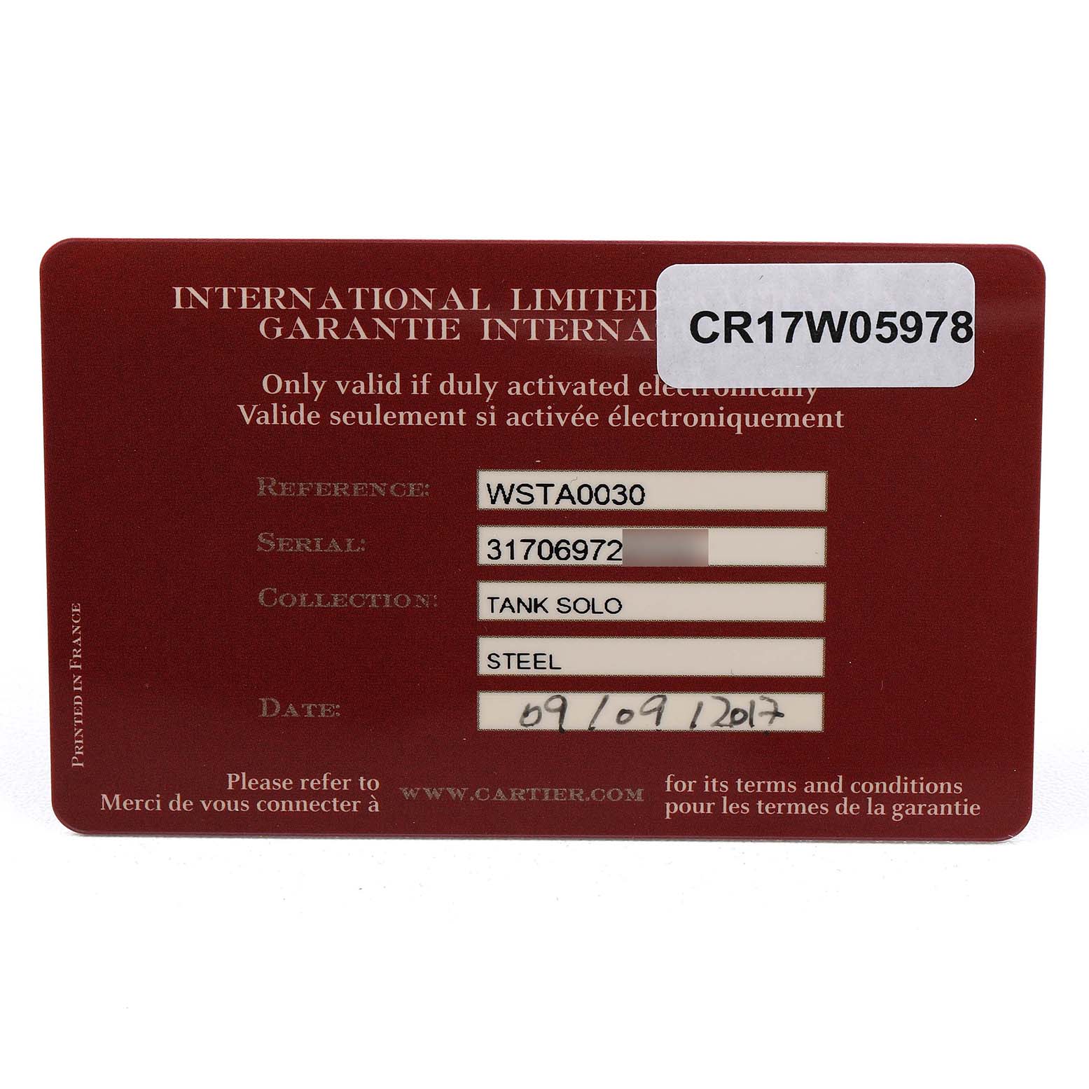 The image shows a warranty card for the Cartier Tank Solo WSTA0030 Women's Stainless Steel Silver Dial watch, displaying reference, serial number, and purchase date.