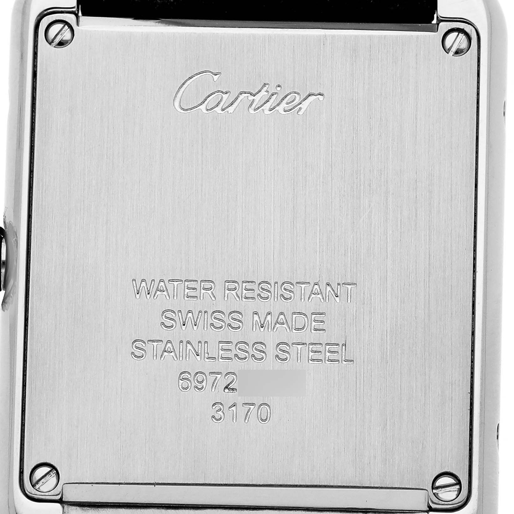 The image shows the back casing of a Cartier Tank Solo WSTA0030 Women's Stainless Steel Silver Dial watch, highlighting the engraved specifications.