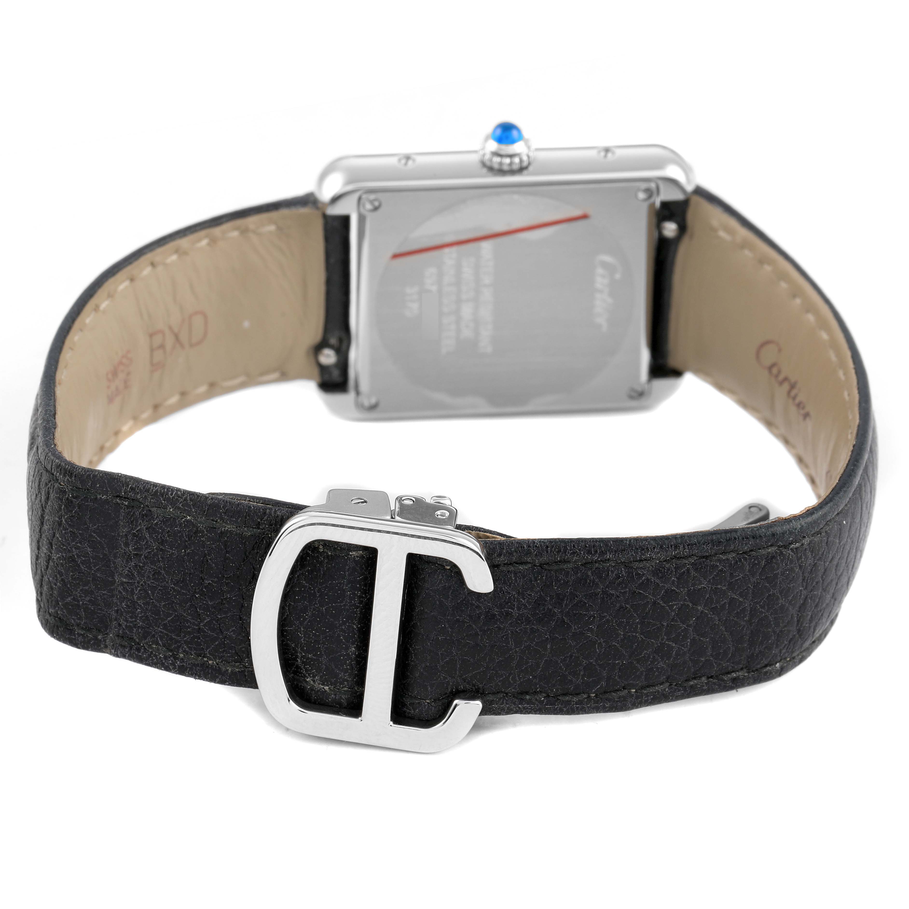 The image shows the back of the Cartier Tank Solo WSTA0030 Women's Stainless Steel Silver Dial watch, including the case, strap, and distinctive buckle.