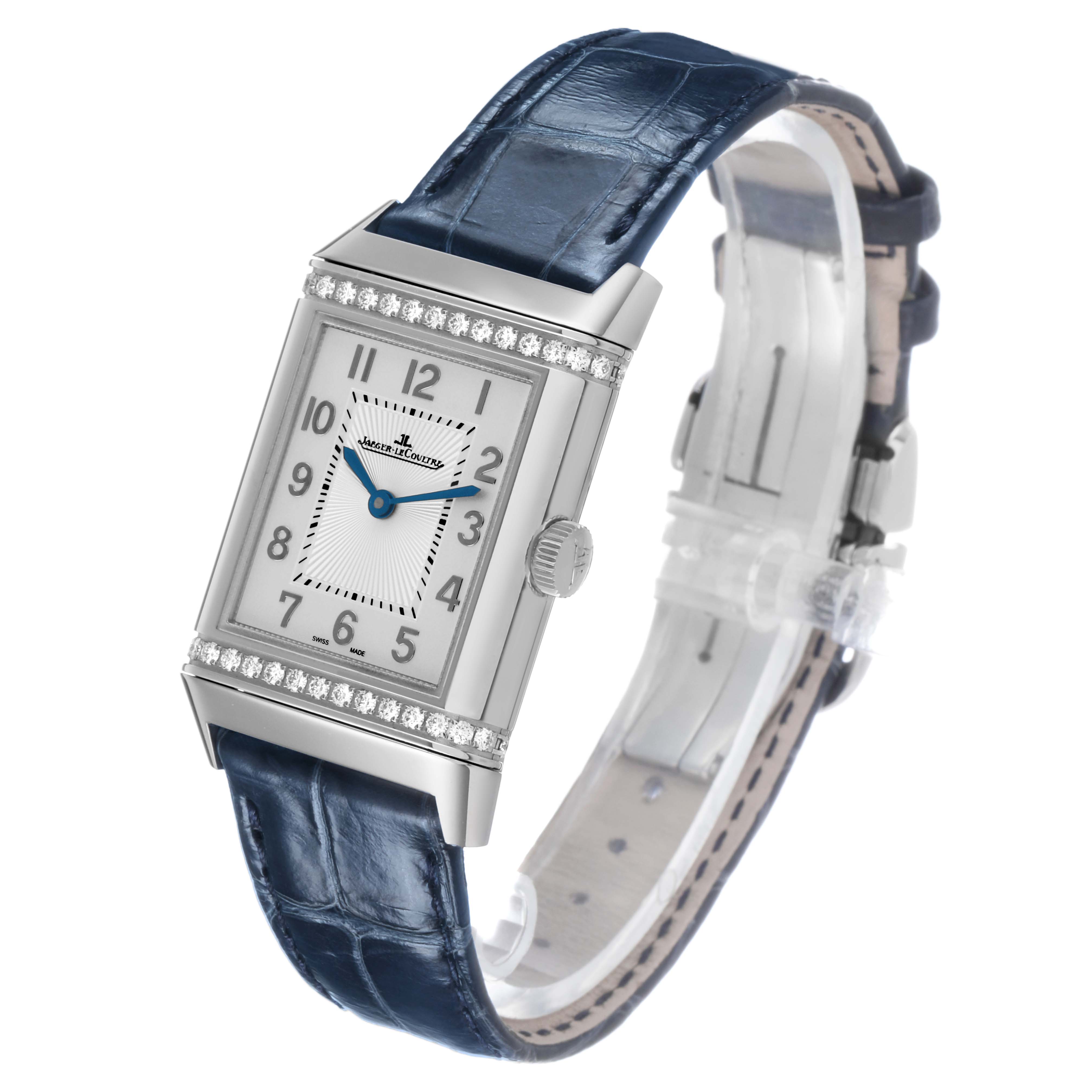 The Jaeger-LeCoultre Reverso watch is shown at a three-quarter angle, displaying the face, case, crown, and blue leather strap.
