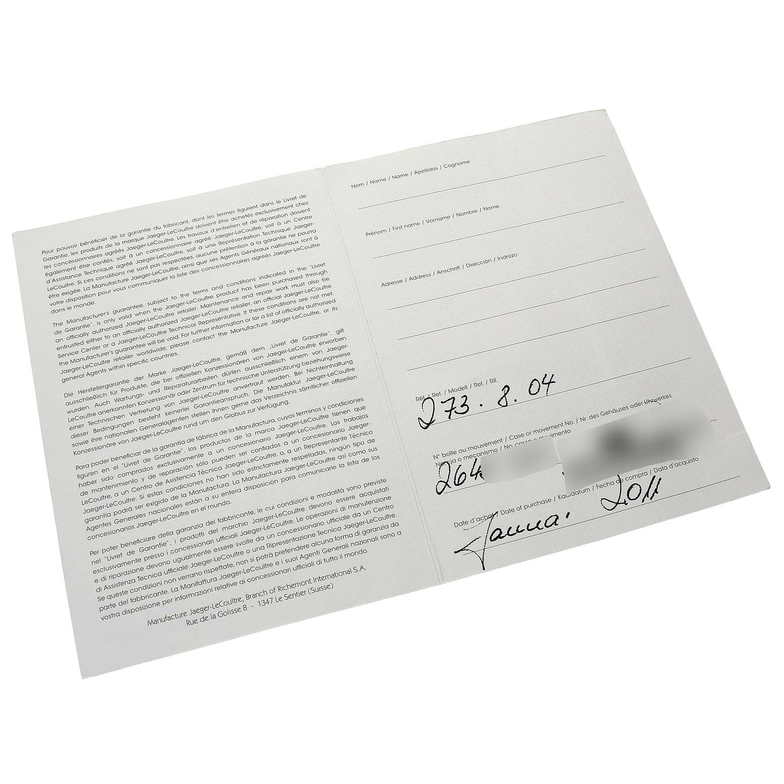 The image shows warranty paperwork for the Jaeger LeCoultre Reverso Q3738420 Men's Stainless Steel Silver Dial model, laying flat with handwritten details visible.