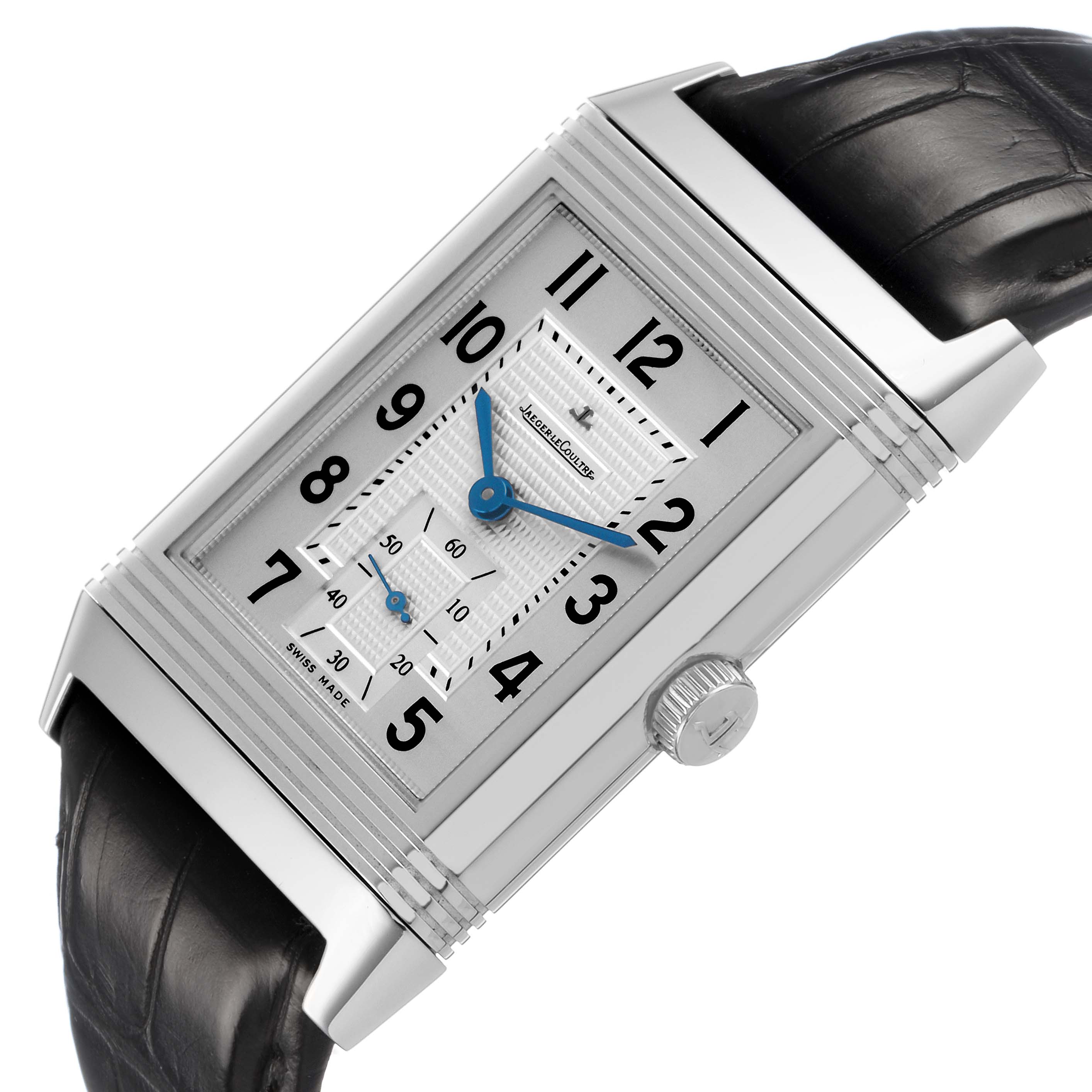 The Jaeger-LeCoultre Reverso watch is shown at an angled view, highlighting its rectangular face, side crown, and strap connection.