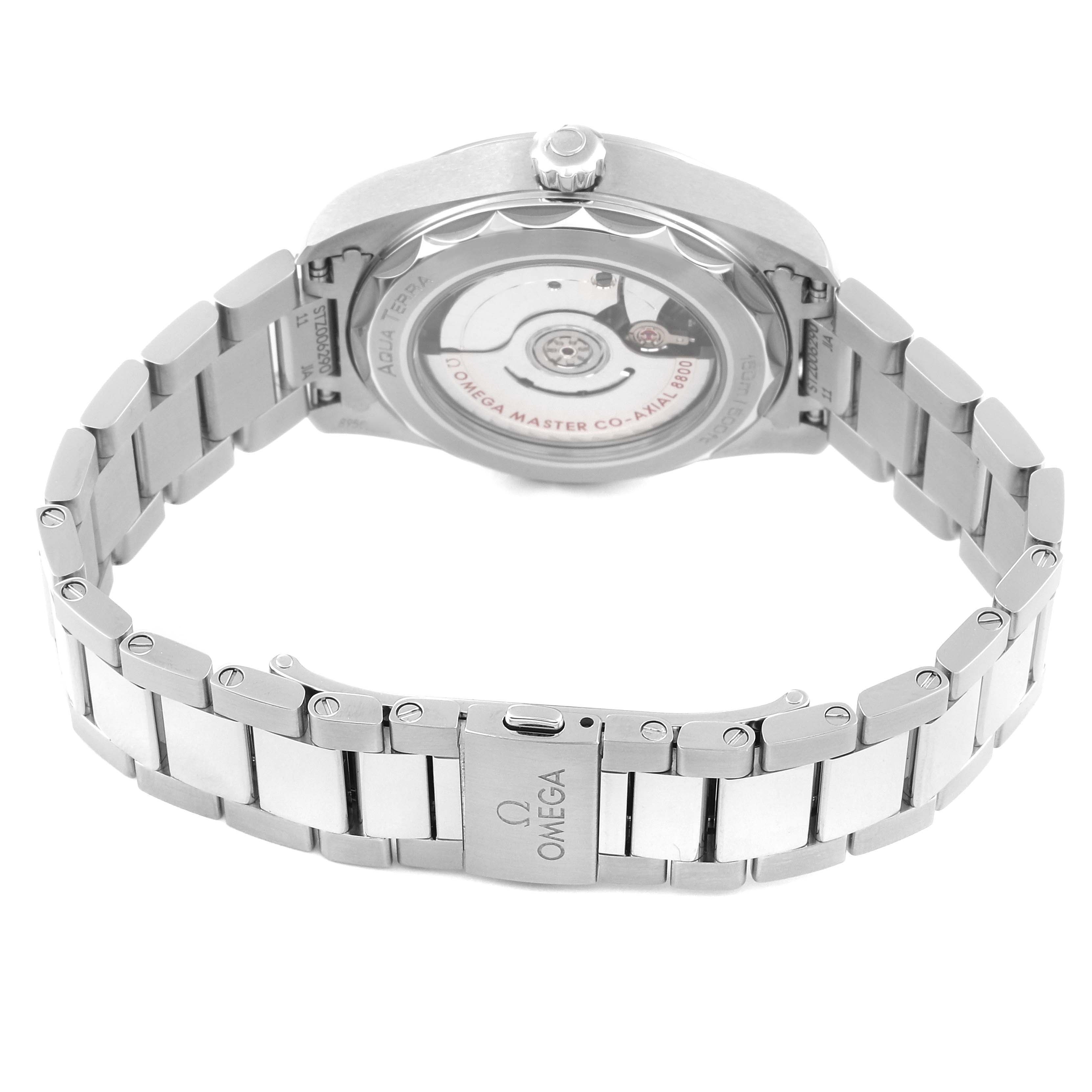 This image shows the open stainless steel clasp and back case of the Omega Aqua Terra 220.10.38.20.03.001 Men's Stainless Steel Blue Dial 220.10.38.20.03.001 Men's Stainless Steel Blue Dial watch, displaying its inner mechanics.