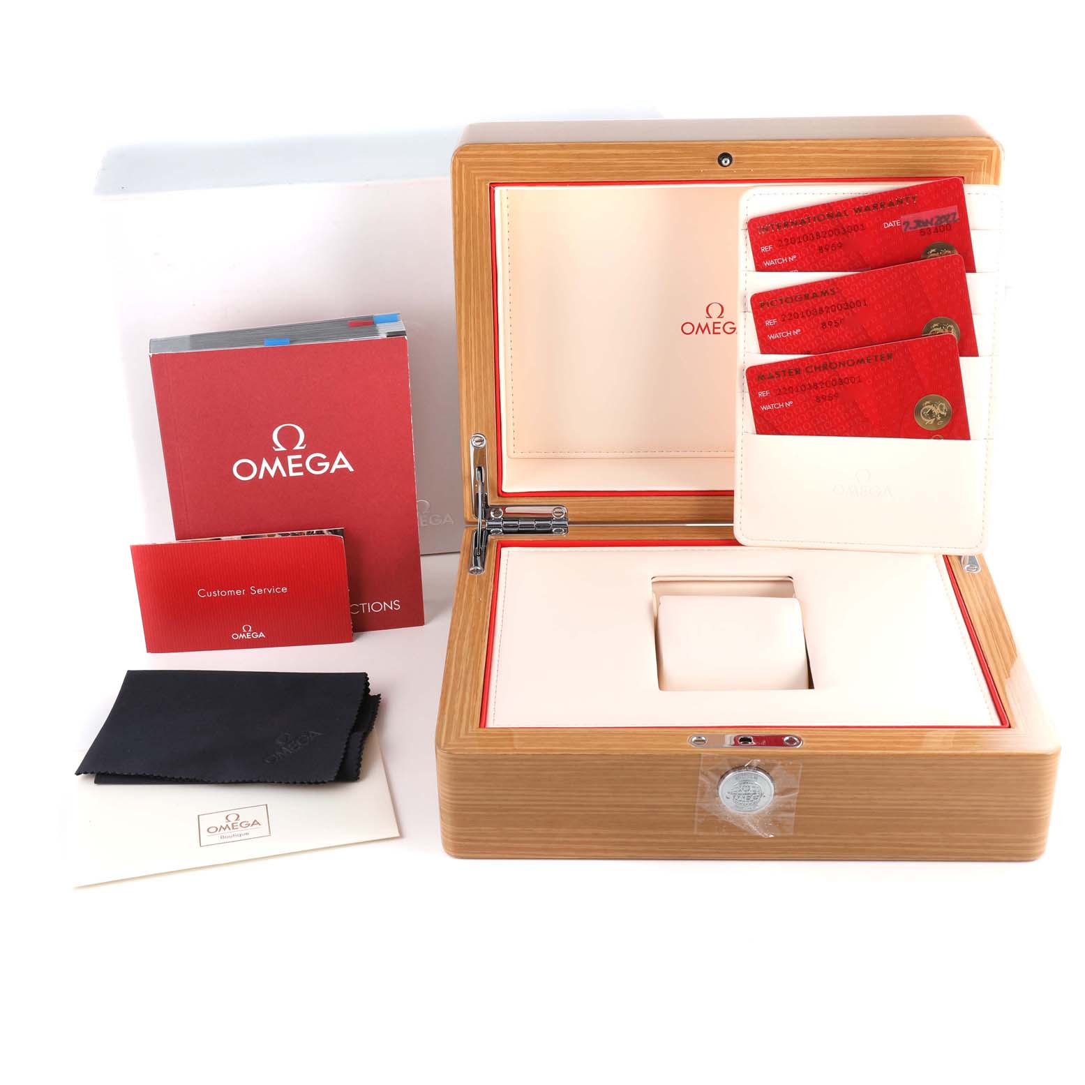 The image shows an Omega Aqua Terra 220.10.38.20.03.001 Men's Stainless Steel Blue Dial 220.10.38.20.03.001 Men's Stainless Steel Blue Dial watch box from a top angle, along with booklets, cards, and a cleaning cloth.