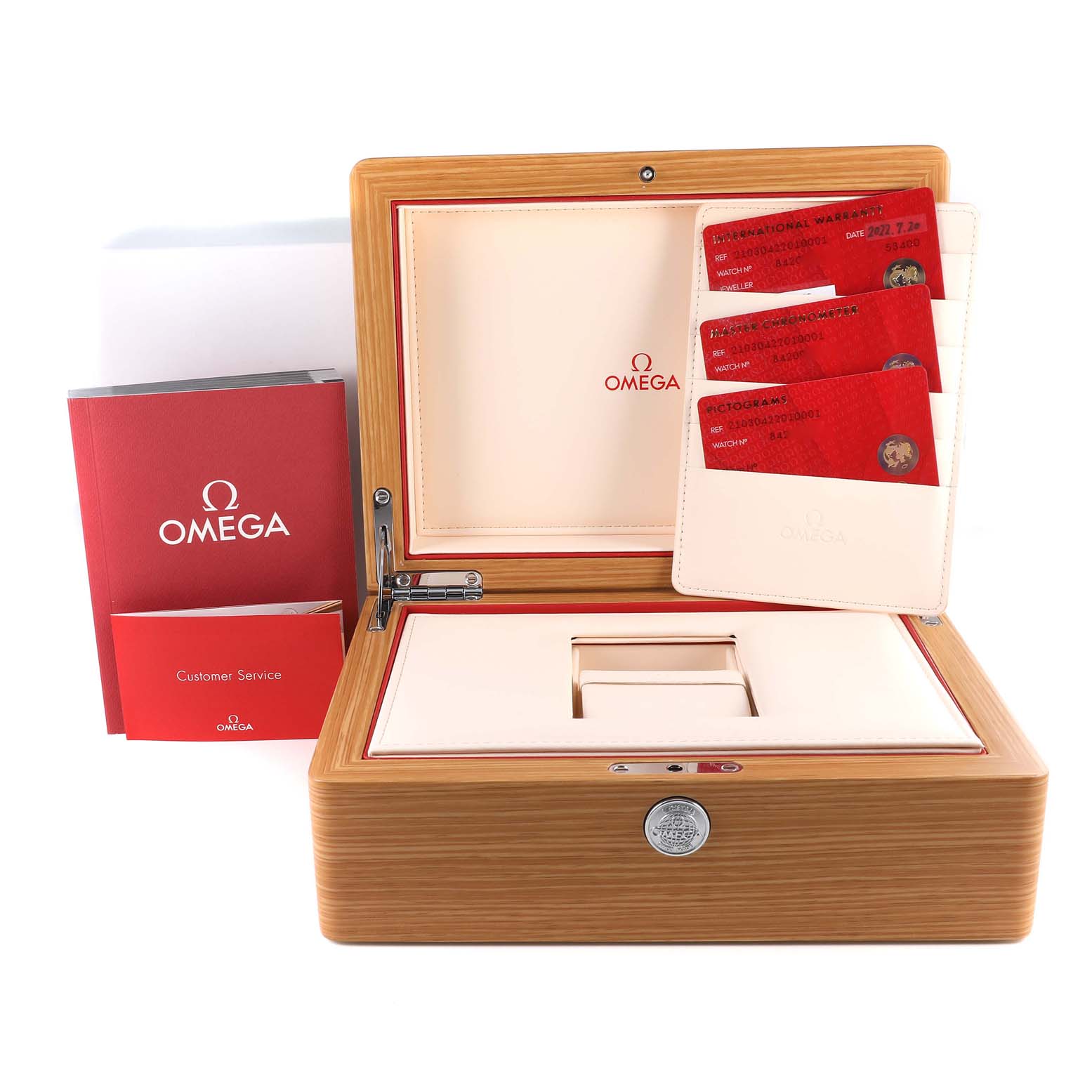 The image shows the open wooden box and accessories for the Omega Seamaster 210.30.42.20.10.001 Men's Stainless Steel Green Dial 210.30.42.20.10.001 Men's Stainless Steel Green Dial watch, including the manual and warranty cards.