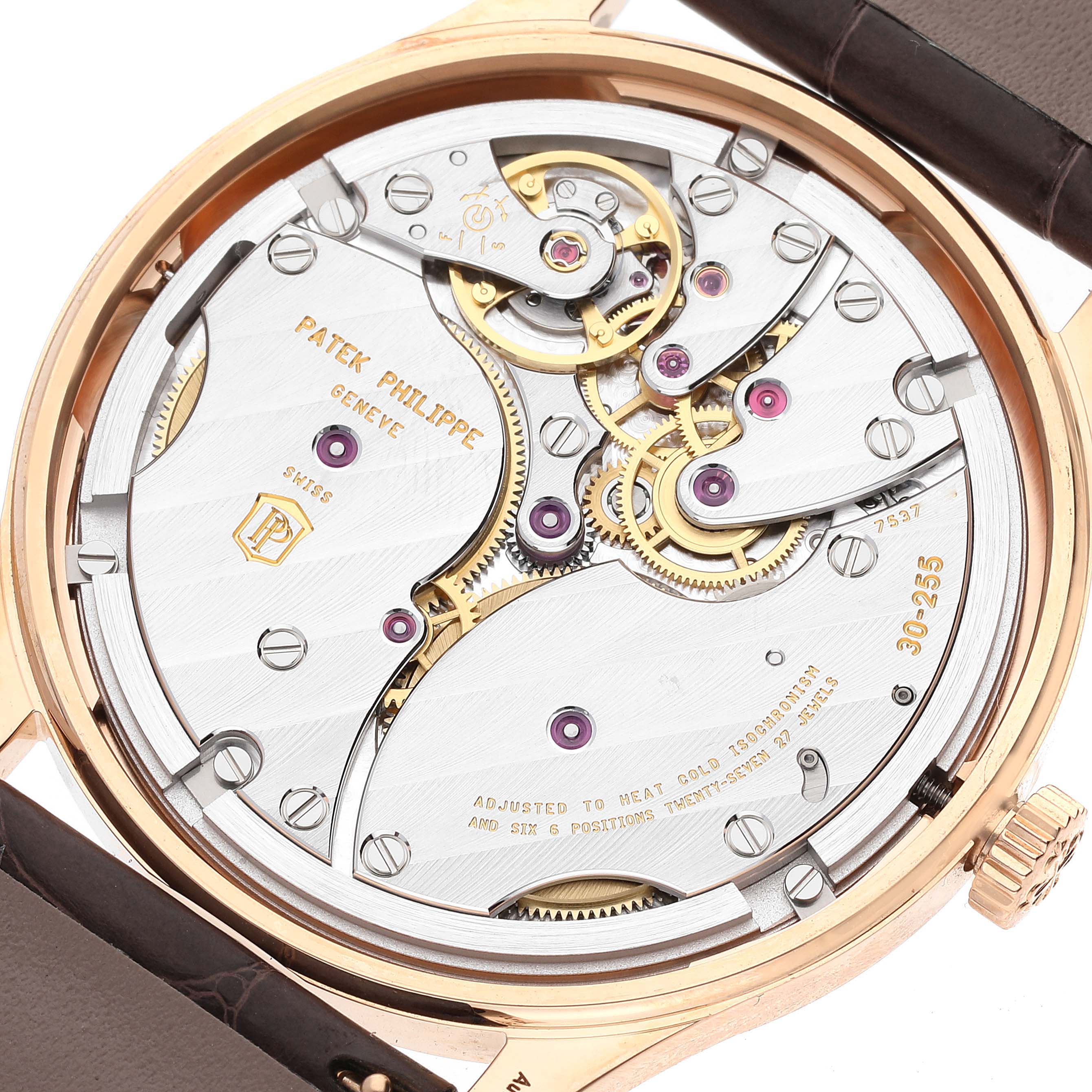 This image shows the open case back of a Patek Philippe Calatrava 6119R-001 Men's Rose Gold Silver Dial 6119R-001 Men's Rose Gold Silver Dial model, revealing its intricate movement mechanism.