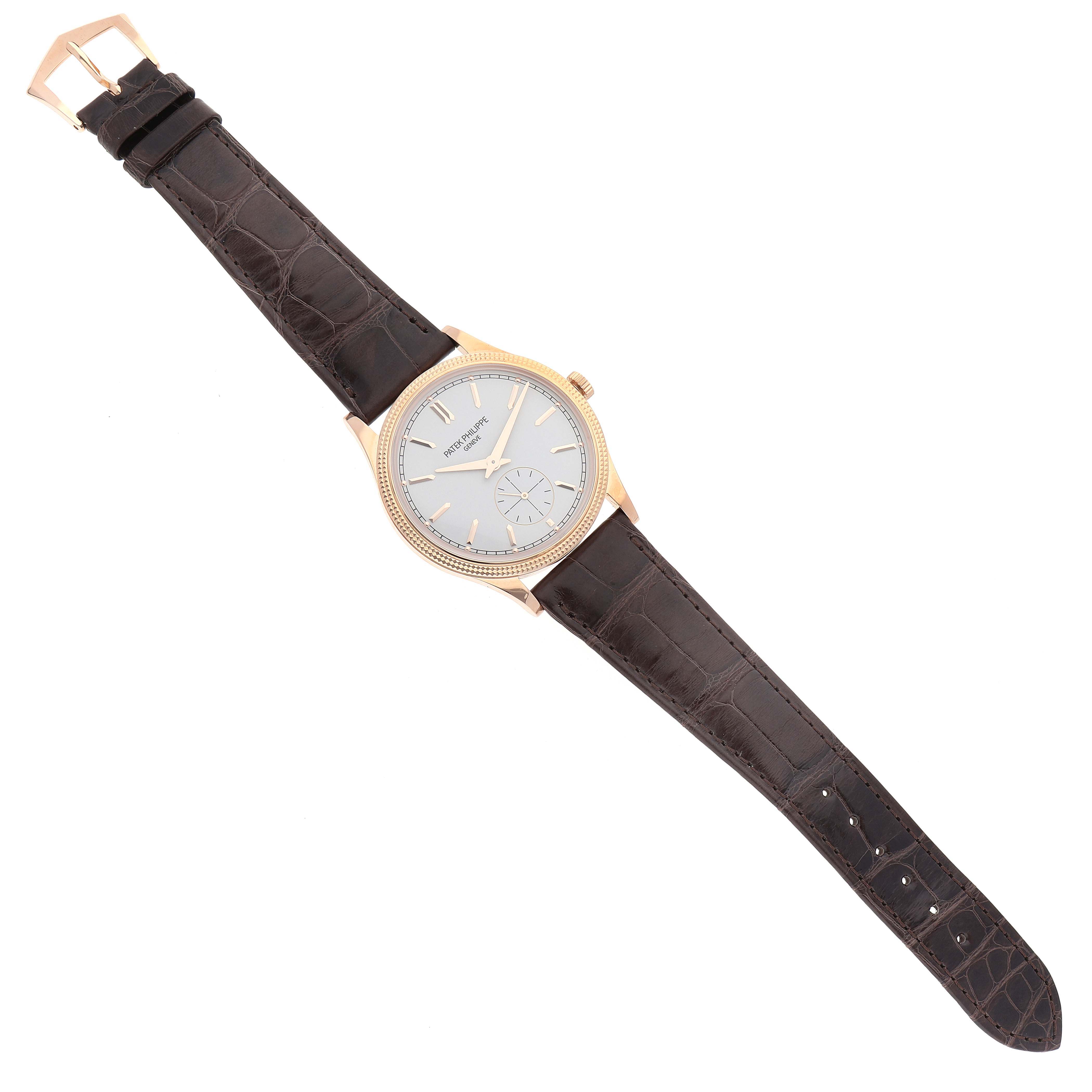 The image shows a Patek Philippe Calatrava 6119R-001 Men's Rose Gold Silver Dial 6119R-001 Men's Rose Gold Silver Dial watch laid flat, displaying its face, bezel, crown, and leather strap.