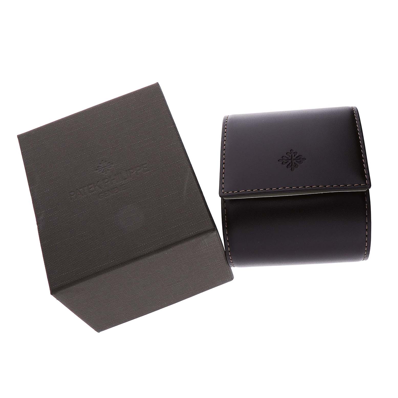 The image shows the packaging and leather case for a Patek Philippe Calatrava 5119R Men's Yellow Gold White Dial watch from a top angle.