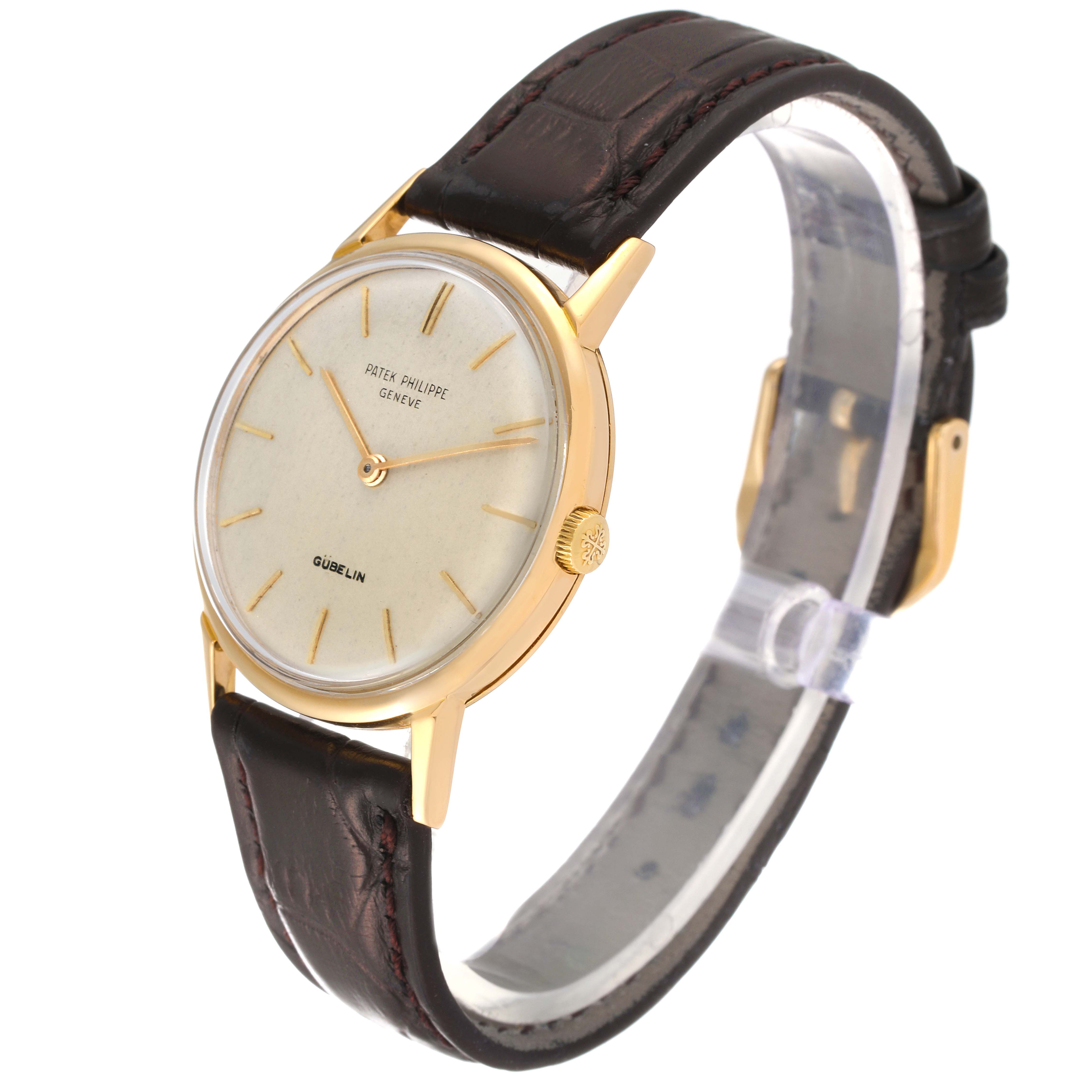The image shows a Patek Philippe Calatrava 3416 Men's Yellow Gold Silver Dial 3416 Men's Yellow Gold Silver Dial watch from a slight angle highlighting the face, bezel, crown, and leather strap.