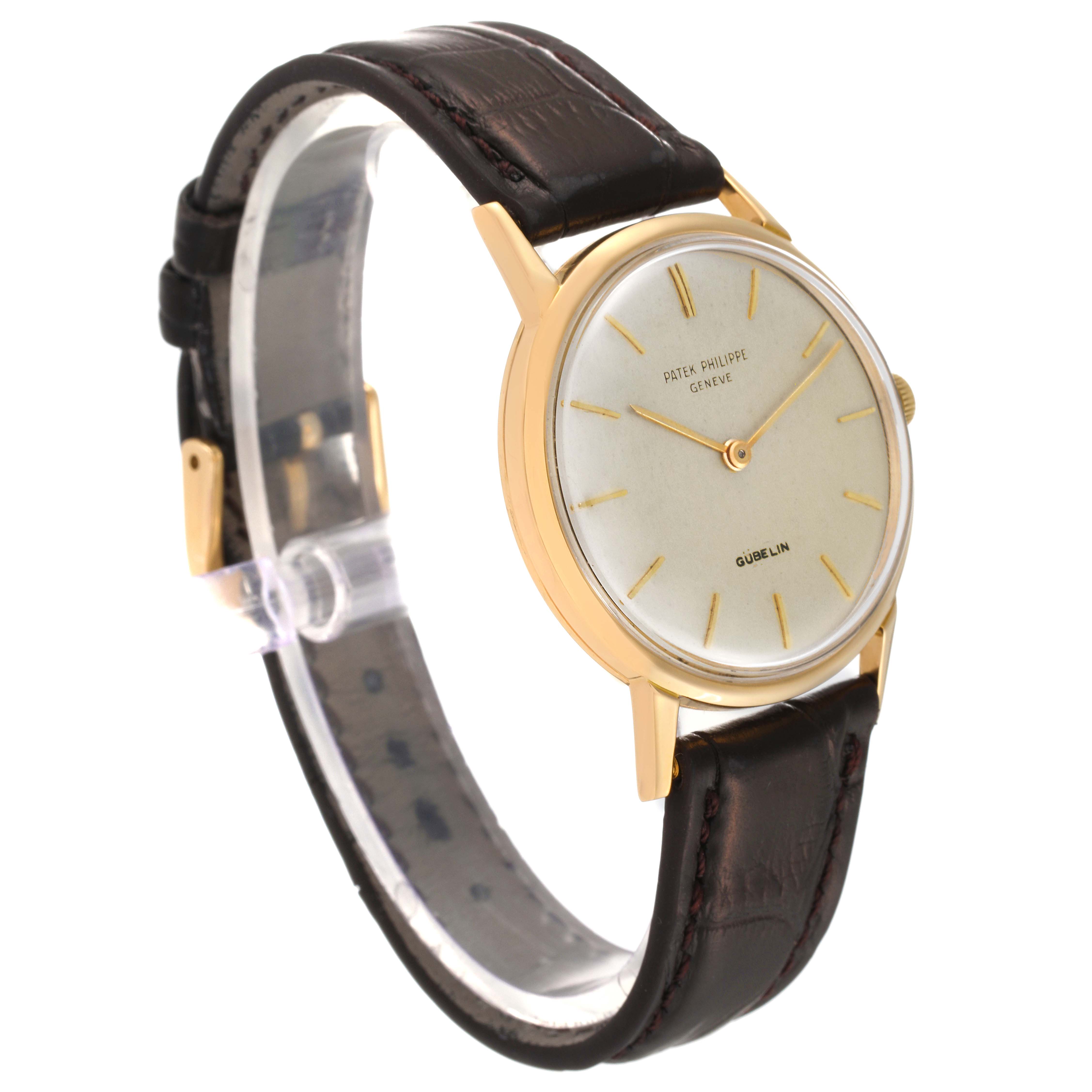 The image shows a side angle of a Patek Philippe Calatrava 3416 Men's Yellow Gold Silver Dial 3416 Men's Yellow Gold Silver Dial watch, highlighting its dial, case, and leather strap.
