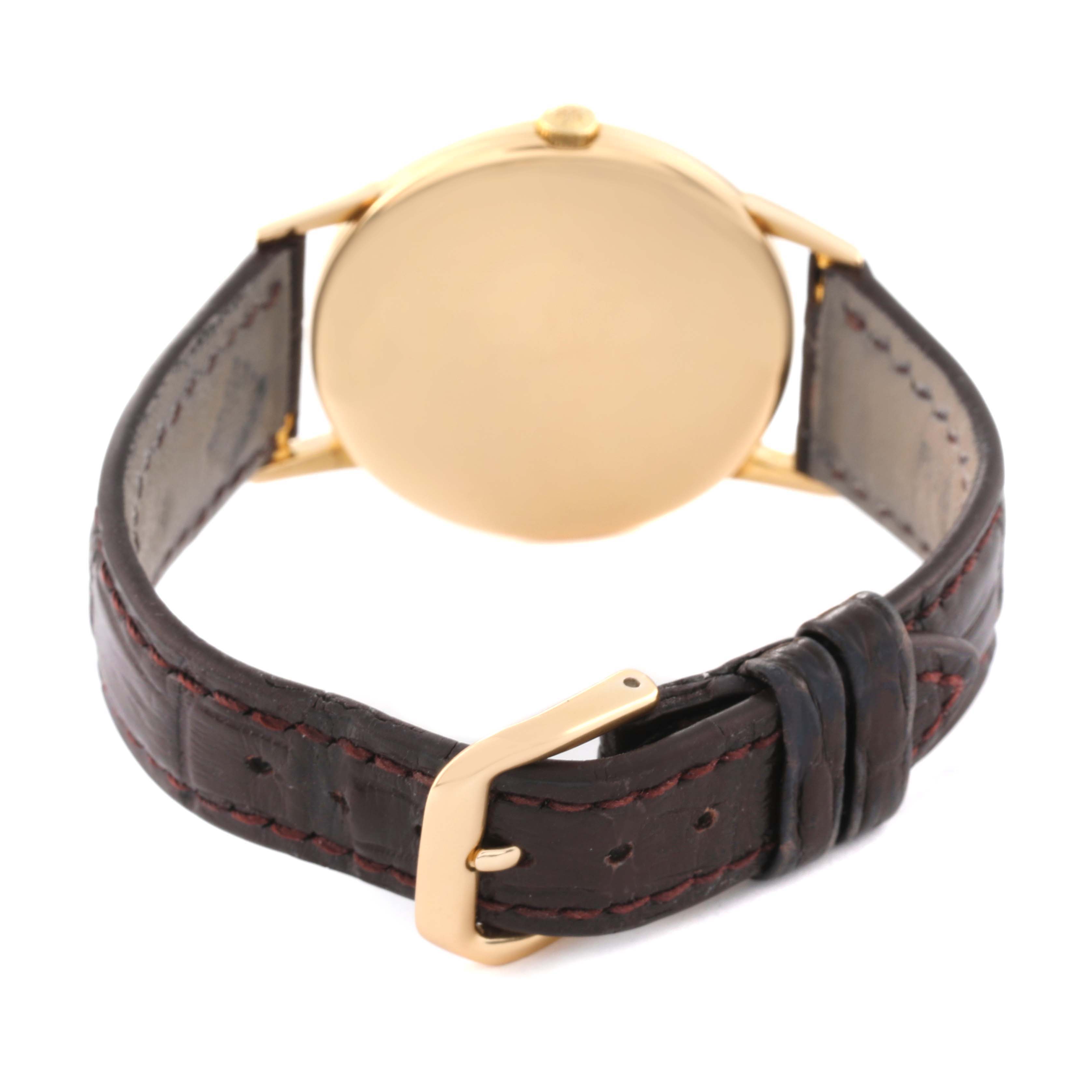 The image shows the back and strap of a Patek Philippe Calatrava 3416 Men's Yellow Gold Silver Dial 3416 Men's Yellow Gold Silver Dial watch, featuring a leather band and gold buckle.