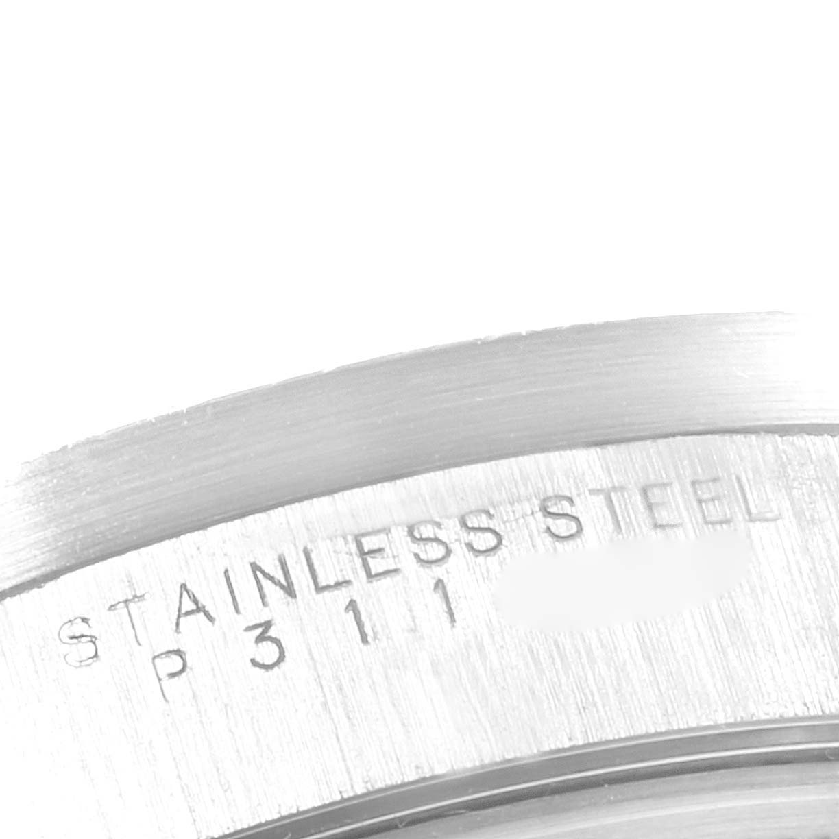 The image shows a close-up of the side of the case back of a Rolex Air-King 14010 Men's Stainless Steel Black Dial 14010 Men's Stainless Steel Black Dial, highlighting the stainless steel material and part of the serial number.