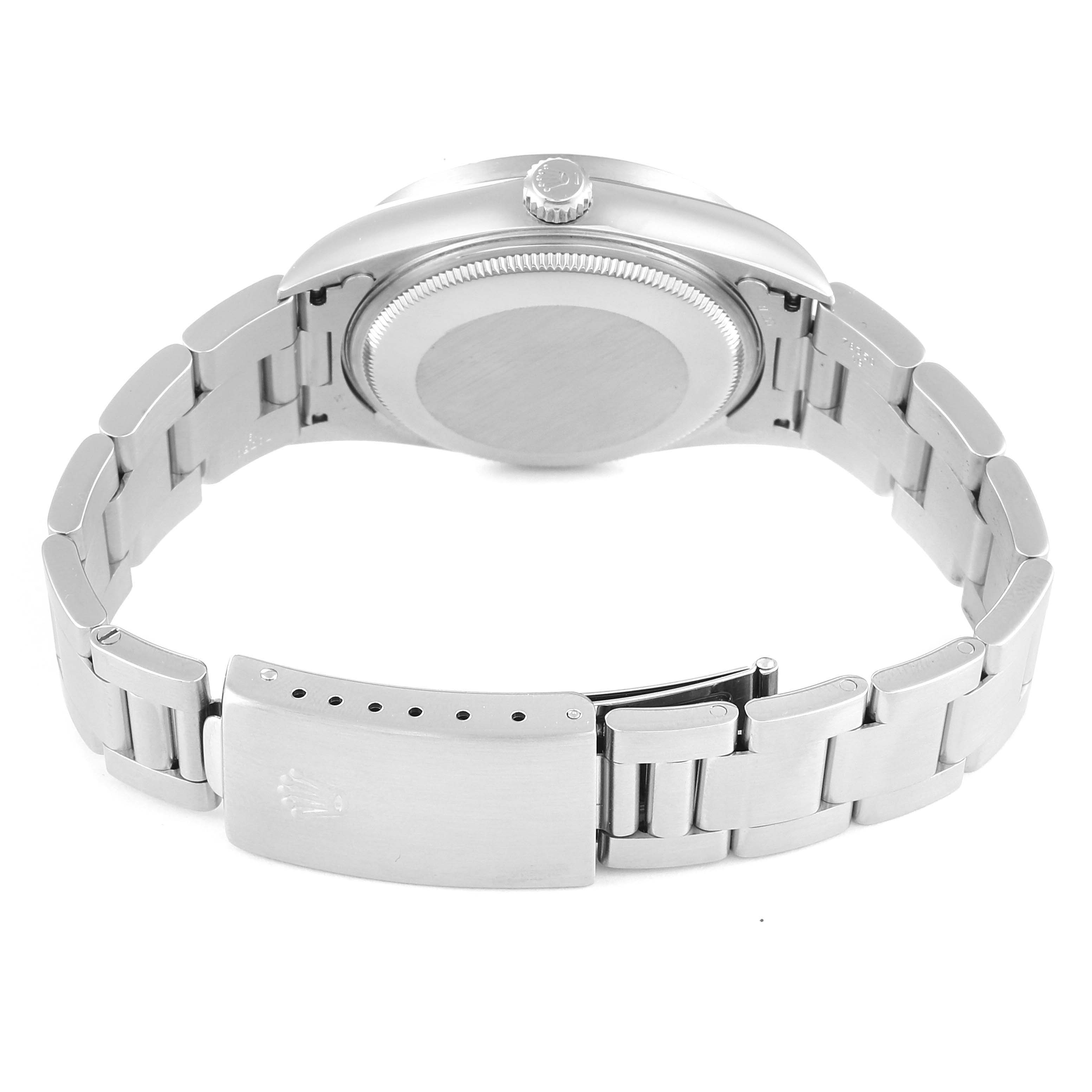 The image shows the back view of a Rolex Air-King 14010 Men's Stainless Steel Black Dial 14010 Men's Stainless Steel Black Dial watch with its closed stainless steel bracelet and clasp.