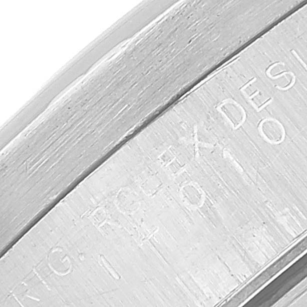 The image shows a close-up of the engraved text on the rim of the case back of a Rolex Air-King 14010 Men's Stainless Steel Black Dial 14010 Men's Stainless Steel Black Dial watch.