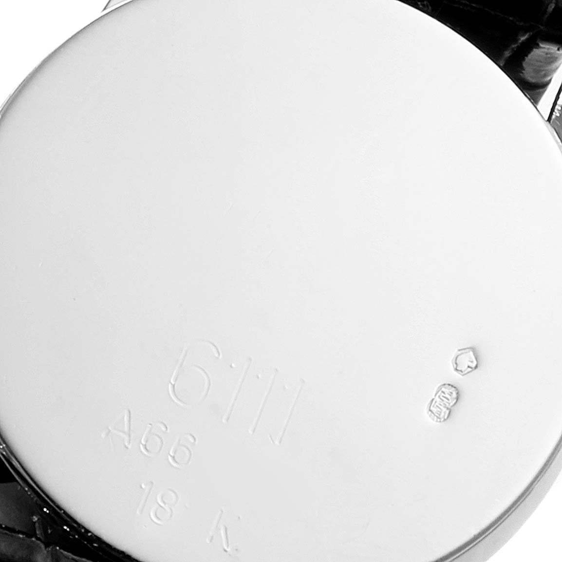 This image shows the back case of the Rolex Cellini 6111 Women's White Gold Black Dial 6111 Women's White Gold Black Dial watch, displaying model and material engravings.