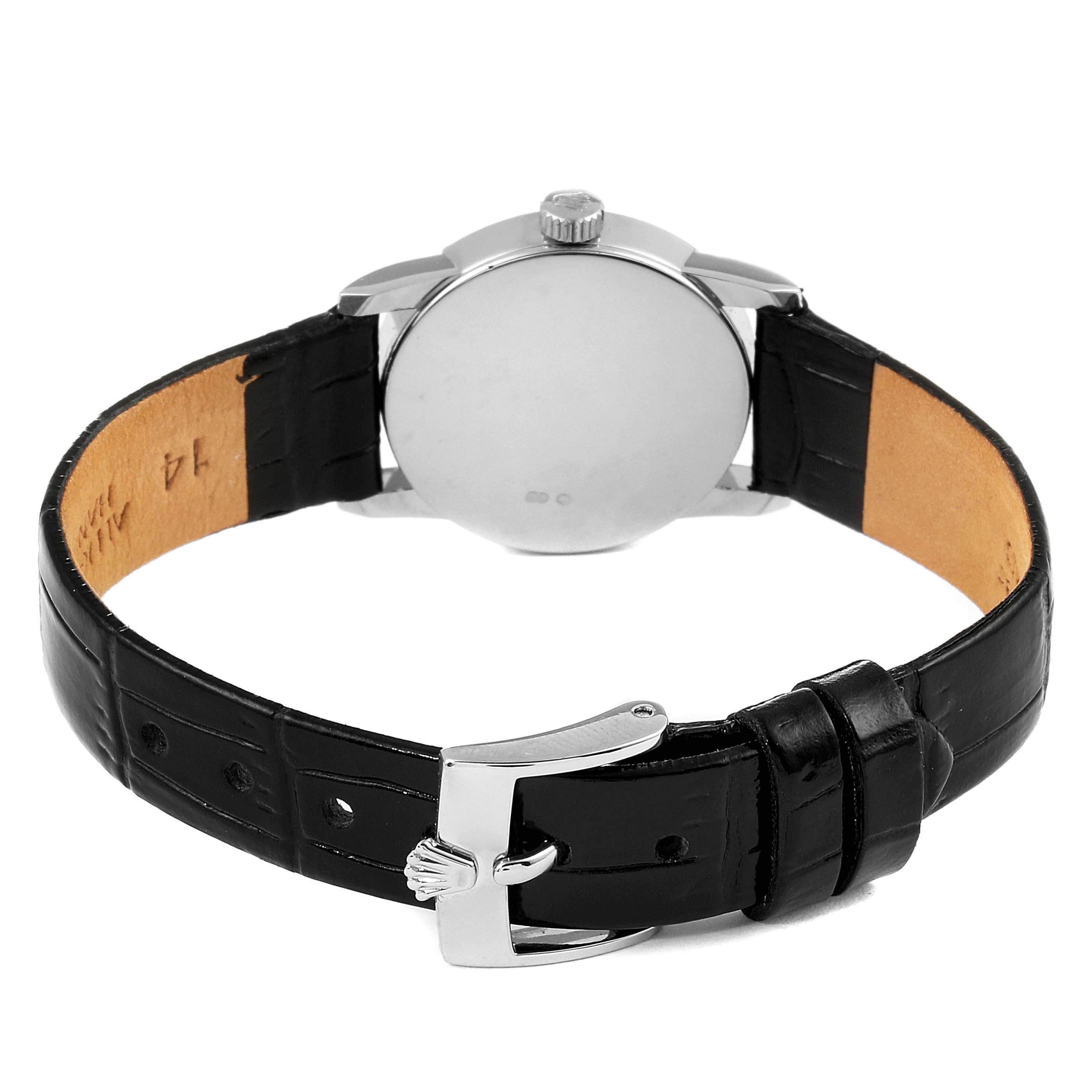 The image shows the back view of a Rolex Cellini 6111 Women's White Gold Black Dial 6111 Women's White Gold Black Dial watch, displaying its leather strap and buckle.