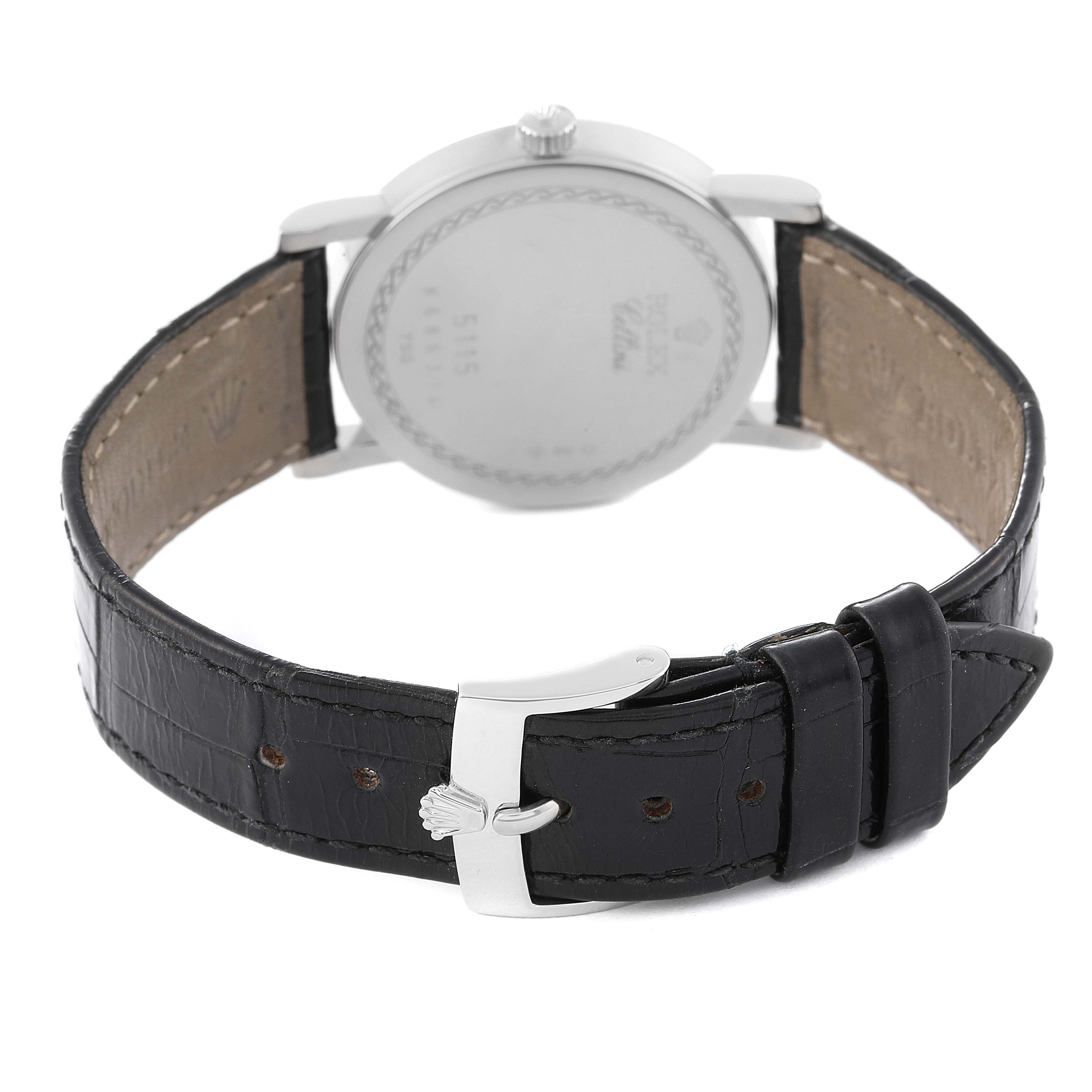 The image shows the back view of a Rolex Cellini 5115 Men's White Gold Black Dial 5115 Men's White Gold Black Dial watch, highlighting its leather strap and buckle.