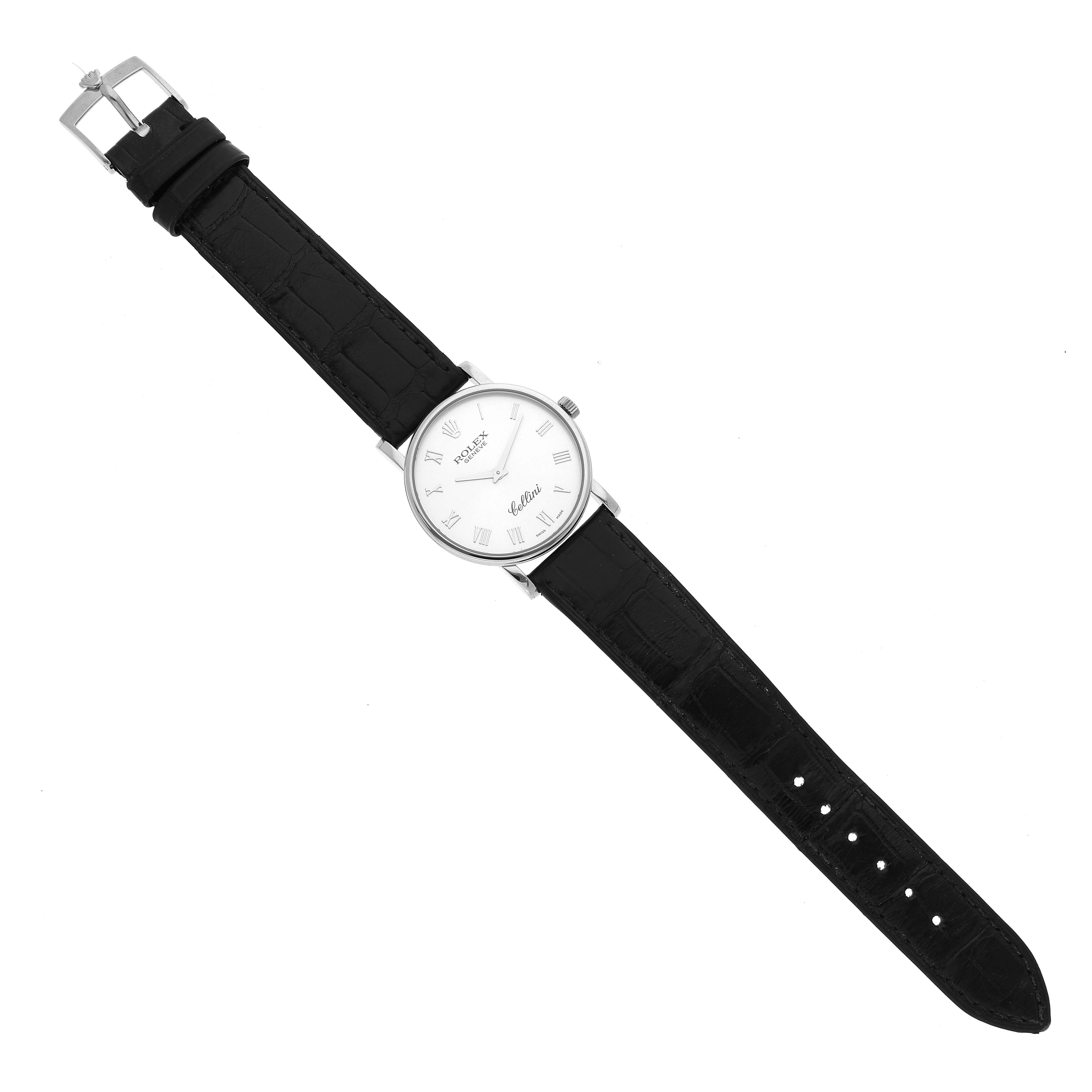 The image shows a Rolex Cellini 5115 Men's White Gold Silver Dial 5115 Men's White Gold Silver Dial watch from a top-down angle, displaying its black leather strap and white dial.