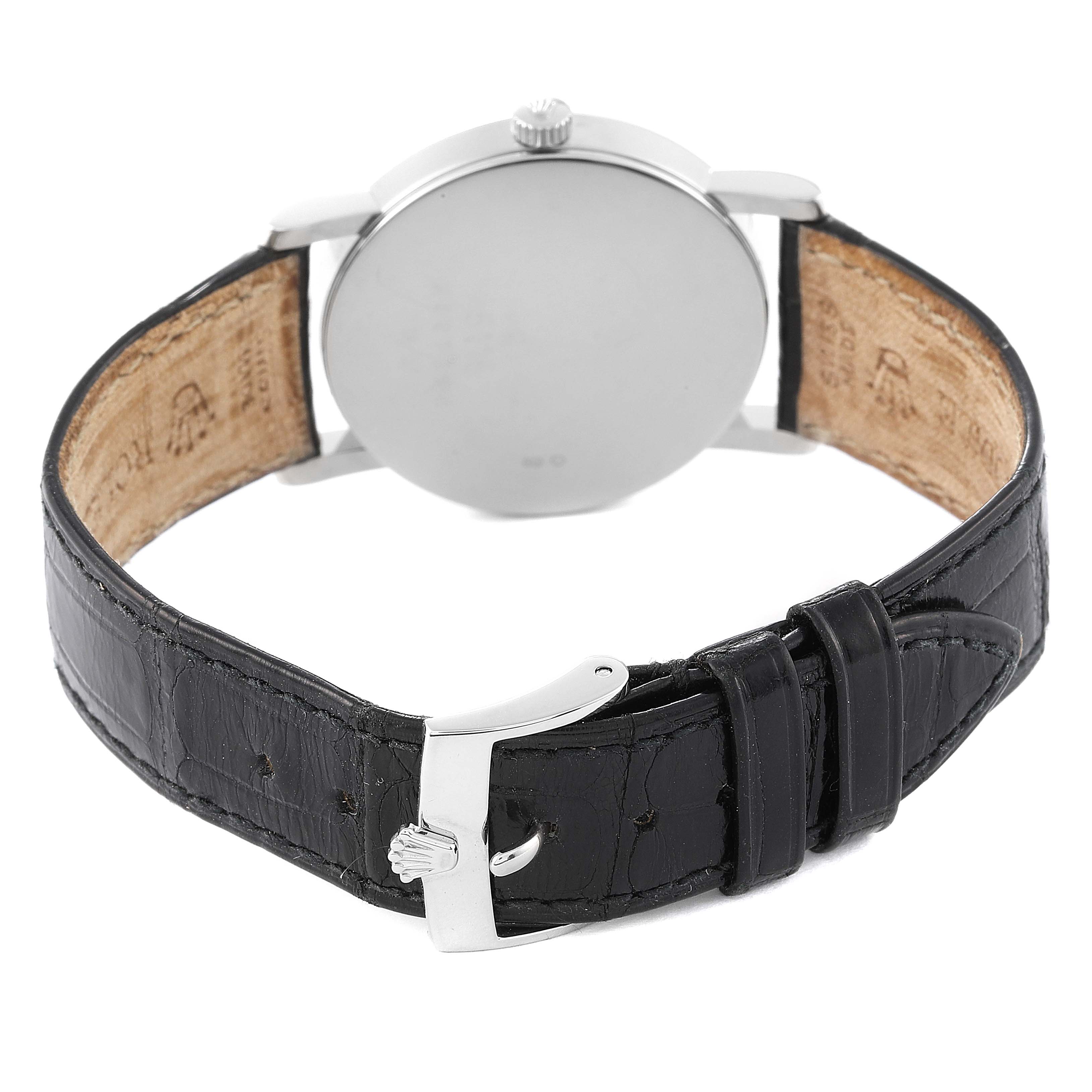 This photo shows the back of the Rolex Cellini 5115 Men's White Gold Silver Dial 5115 Men's White Gold Silver Dial watch, including the clasp and leather strap.