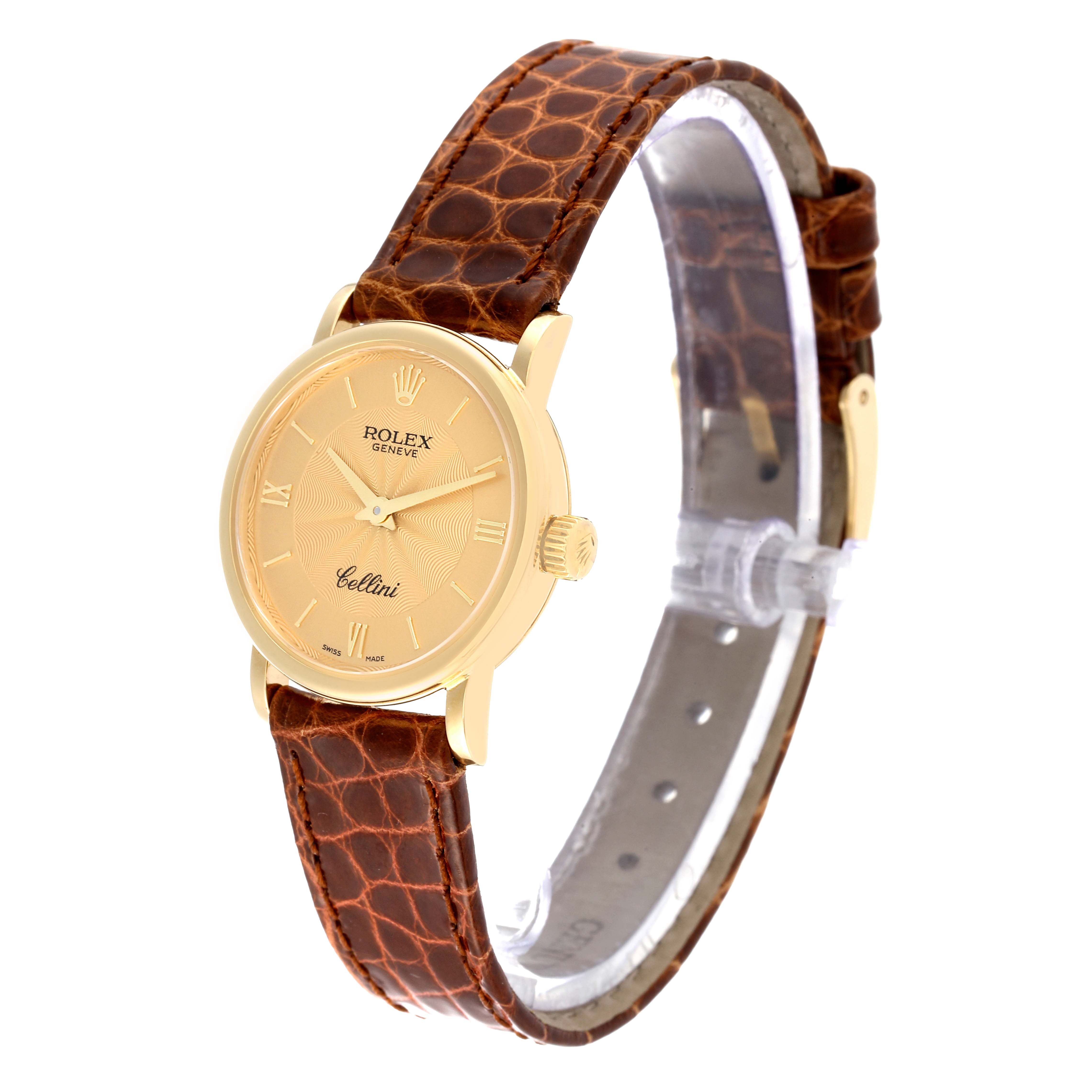 The Rolex Cellini 6110/8 Women's Yellow Gold Champagne Dial 6110/8 Women's Yellow Gold Champagne Dial watch is shown at a slightly angled side view, displaying its brown leather strap and gold-tone case and dial.