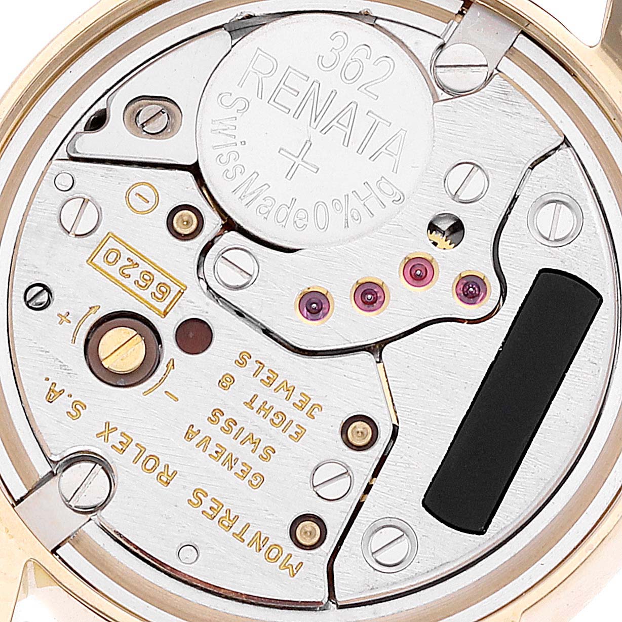 This image shows a close-up of the internal mechanism of a Rolex Cellini 6110/8 Women's Yellow Gold Champagne Dial 6110/8 Women's Yellow Gold Champagne Dial watch, highlighting several components including the battery.