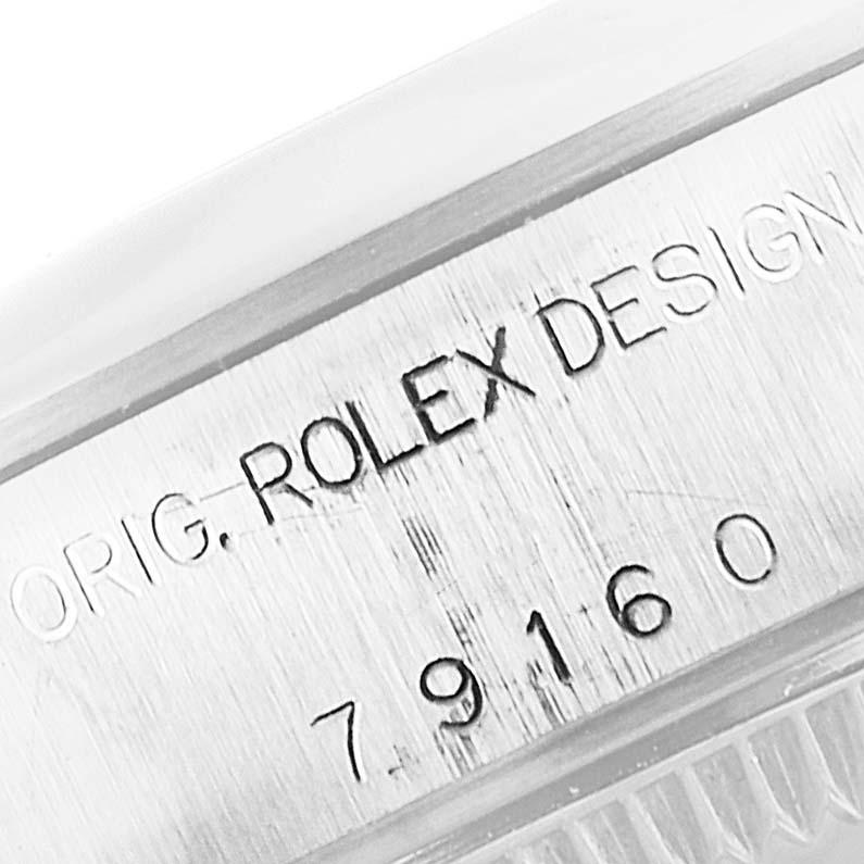 The image shows a close-up view of the side of the Rolex Date 79160 Women's Stainless Steel Silver Dial 79160 Women's Stainless Steel Silver Dial model watch, displaying the engraved design and model number.