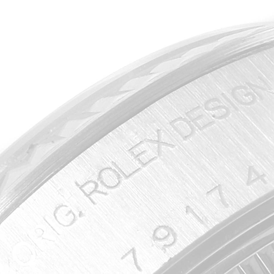 This is a close-up of the engraving on the case back or bezel of a Rolex Datejust 79174 Women's Stainless Steel Pink Dial 79174 Women's Stainless Steel Pink Dial watch.