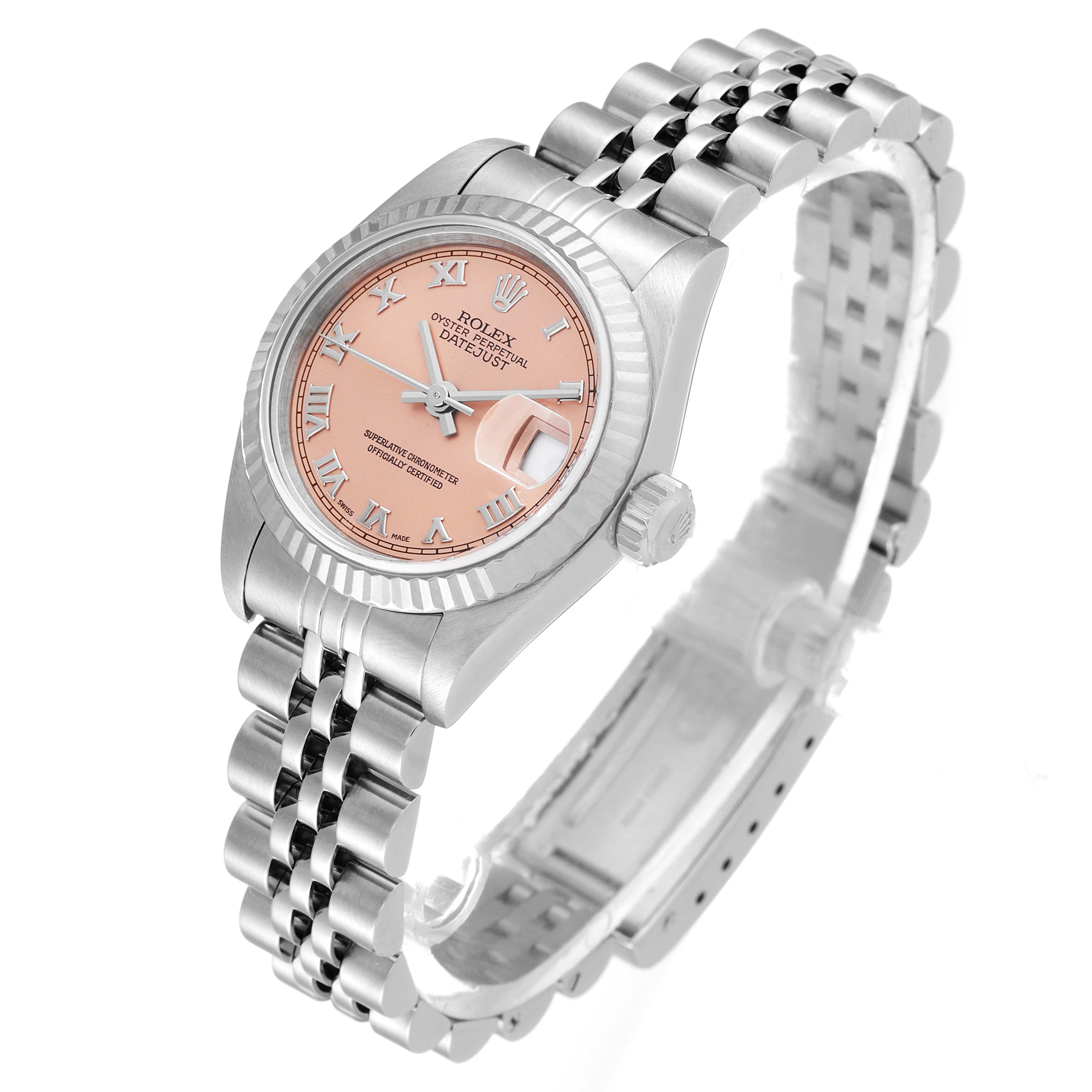 The image shows a Rolex Datejust 79174 Women's Stainless Steel Pink Dial 79174 Women's Stainless Steel Pink Dial watch at an angled view, highlighting its pink dial, fluted bezel, Roman numerals, and Jubilee bracelet.