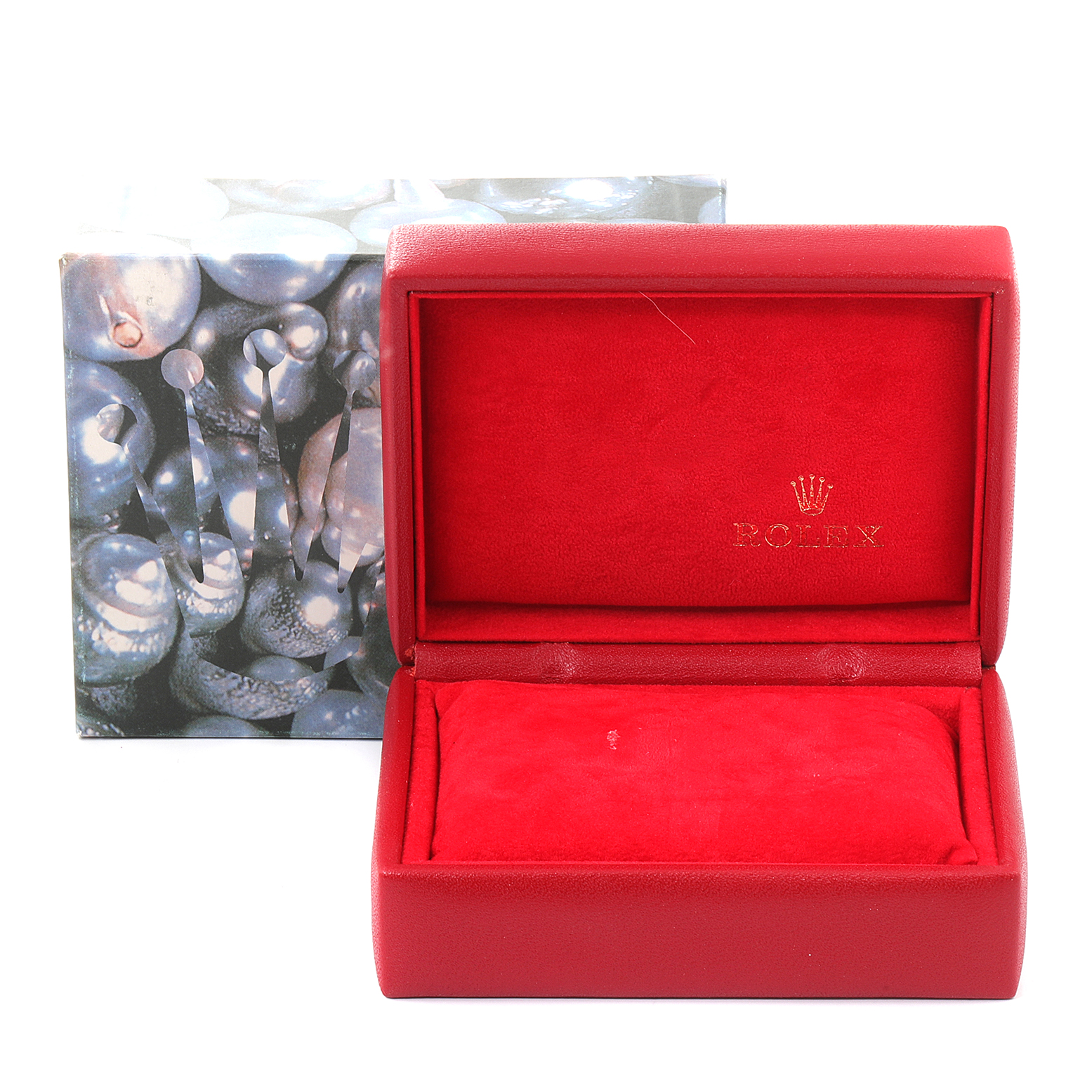 The image shows an open red Rolex box, used for the Datejust model, with a pillow inside and a decorative outer box.