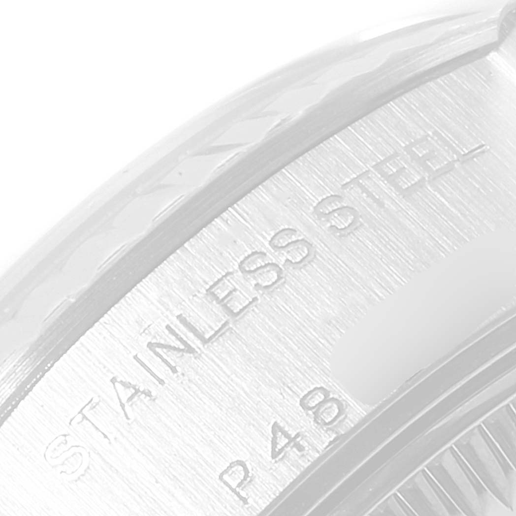 This image shows a close-up of the stainless steel engraved on the bezel or case of a Rolex Datejust 79174 Women's Stainless Steel Pink Dial 79174 Women's Stainless Steel Pink Dial watch.