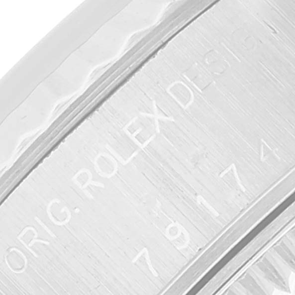 This image shows a close-up of the engraved side of a Rolex Datejust 79174 Women's Stainless Steel Silver Dial 79174 Women's Stainless Steel Silver Dial watch, highlighting the "Orig. Rolex Design" text.
