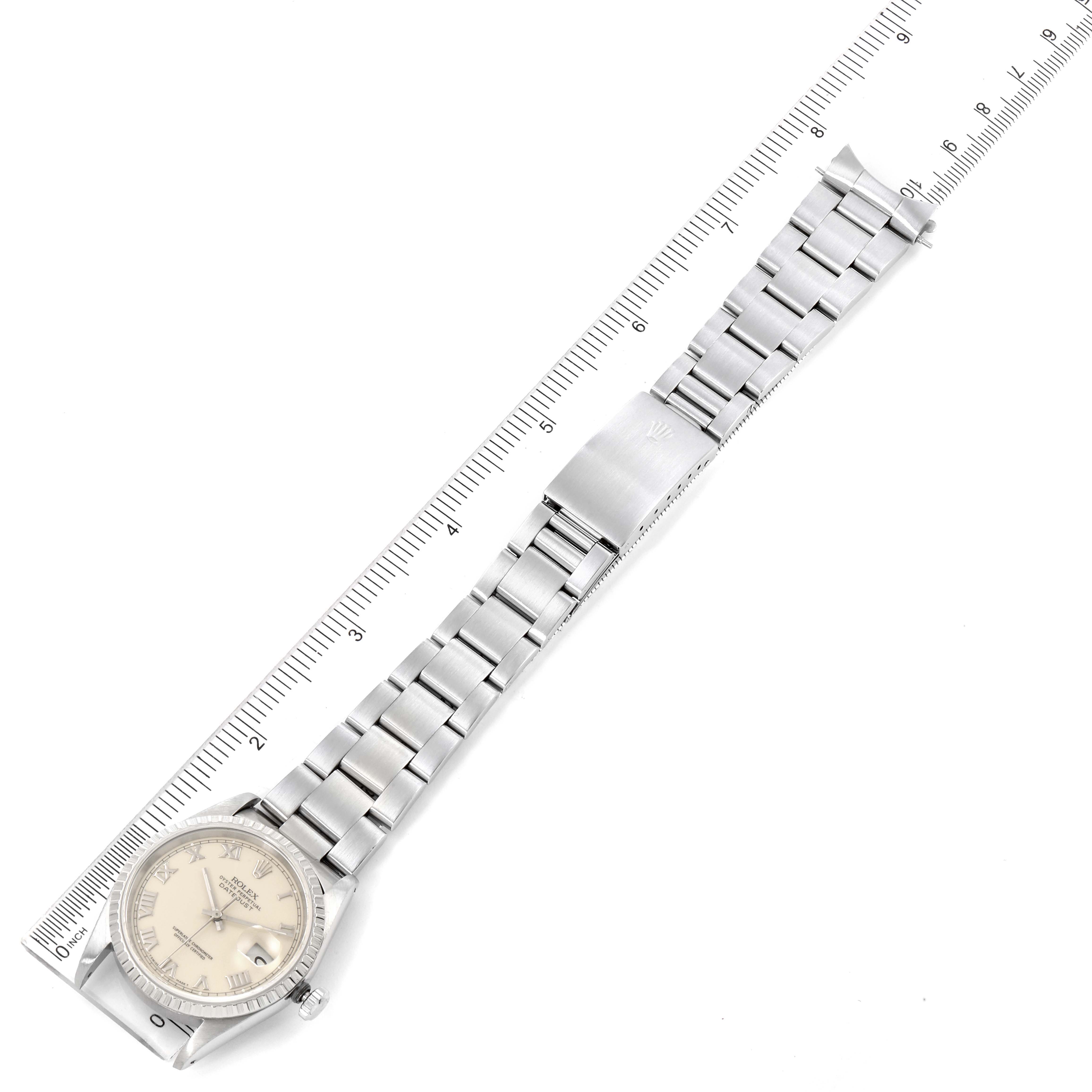 The image shows a Rolex Datejust 16220 Men's Stainless Steel Beige Dial 16220 Men's Stainless Steel Beige Dial watch laid flat with its entire strap and clasp, alongside a ruler for reference.