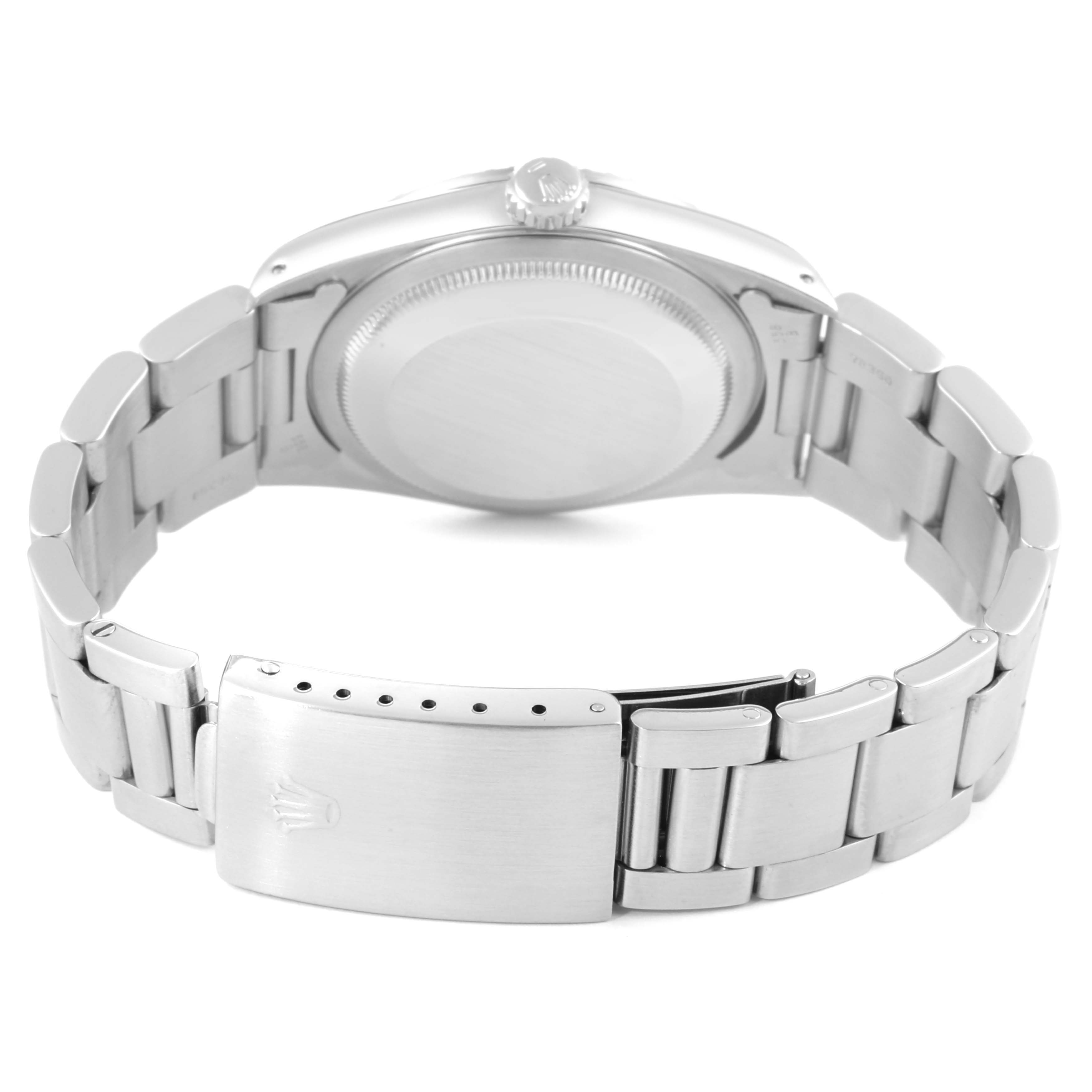 The image shows the back view of a Rolex Datejust 16220 Men's Stainless Steel Beige Dial 16220 Men's Stainless Steel Beige Dial watch, highlighting its case back, crown, and partially opened clasp.