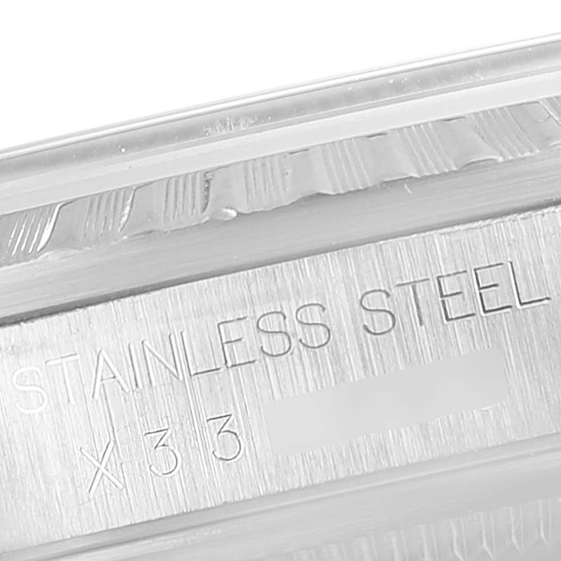 This image shows a close-up of the side casing and engraved details of the Rolex Datejust 16220 Men's Stainless Steel Beige Dial 16220 Men's Stainless Steel Beige Dial model in stainless steel.