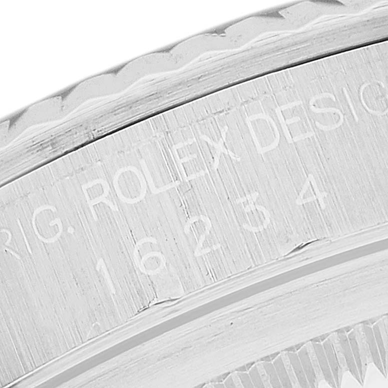 The image shows a close-up angle of the engraved text on the bezel of a Rolex Datejust 16234 Men's Stainless Steel Silver Dial 16234 Men's Stainless Steel Silver Dial watch.