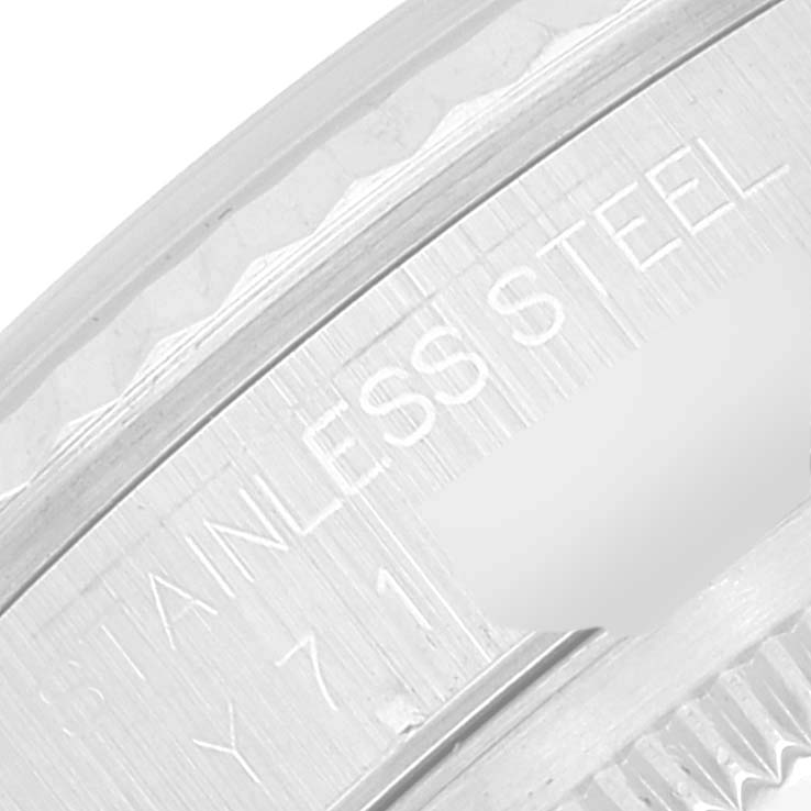 This image shows a close-up of the bezel and part of the engraving on a Rolex Datejust 16234 Men's Stainless Steel Silver Dial 16234 Men's Stainless Steel Silver Dial watch.