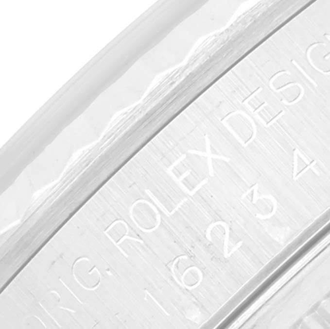 This image shows a close-up angle of the casing with "ROLEX DESIGN" etched inside a Datejust model by Rolex.