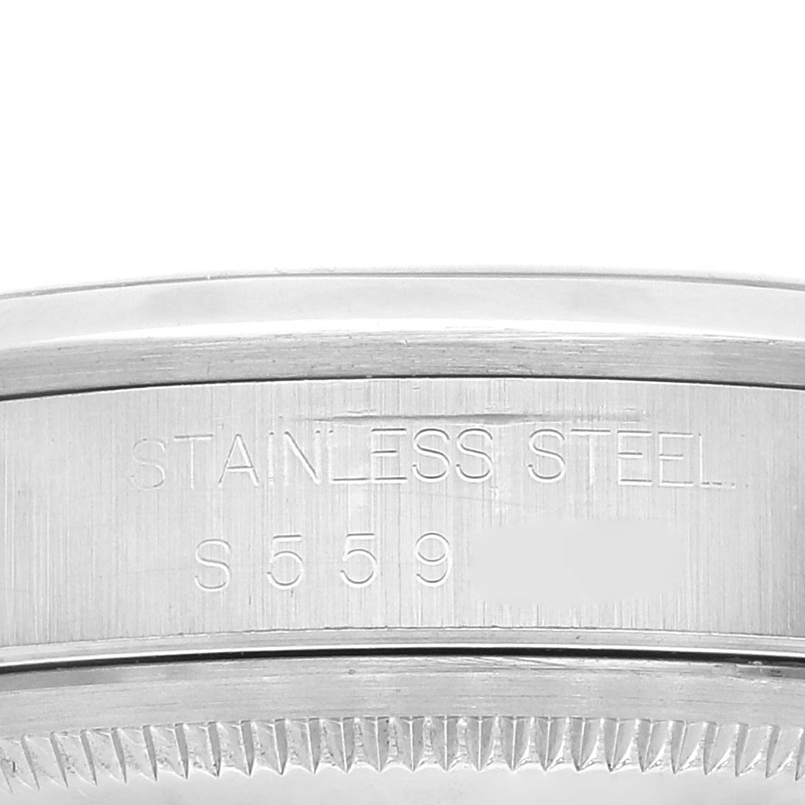 This image shows a close-up of the side of a Rolex Datejust 16200 Men's Stainless Steel Blue Dial 16200 Men's Stainless Steel Blue Dial watch, highlighting the bezel and stainless steel engraving.