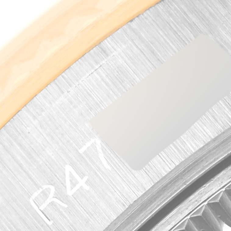 The image shows a close-up of the outer rim and part of the bezel of a Rolex Datejust 69173 Women's Steel and Gold (two tone) Blue Dial 69173 Women's Steel and Gold (two tone) Blue Dial watch.