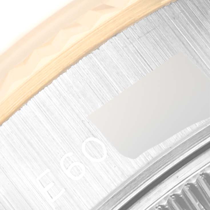 The image shows a close-up view of the bezel and outer rim of the dial of a Rolex Datejust 69173 Women's Steel and Gold (two tone) Champagne Dial 69173 Women's Steel and Gold (two tone) Champagne Dial model watch.